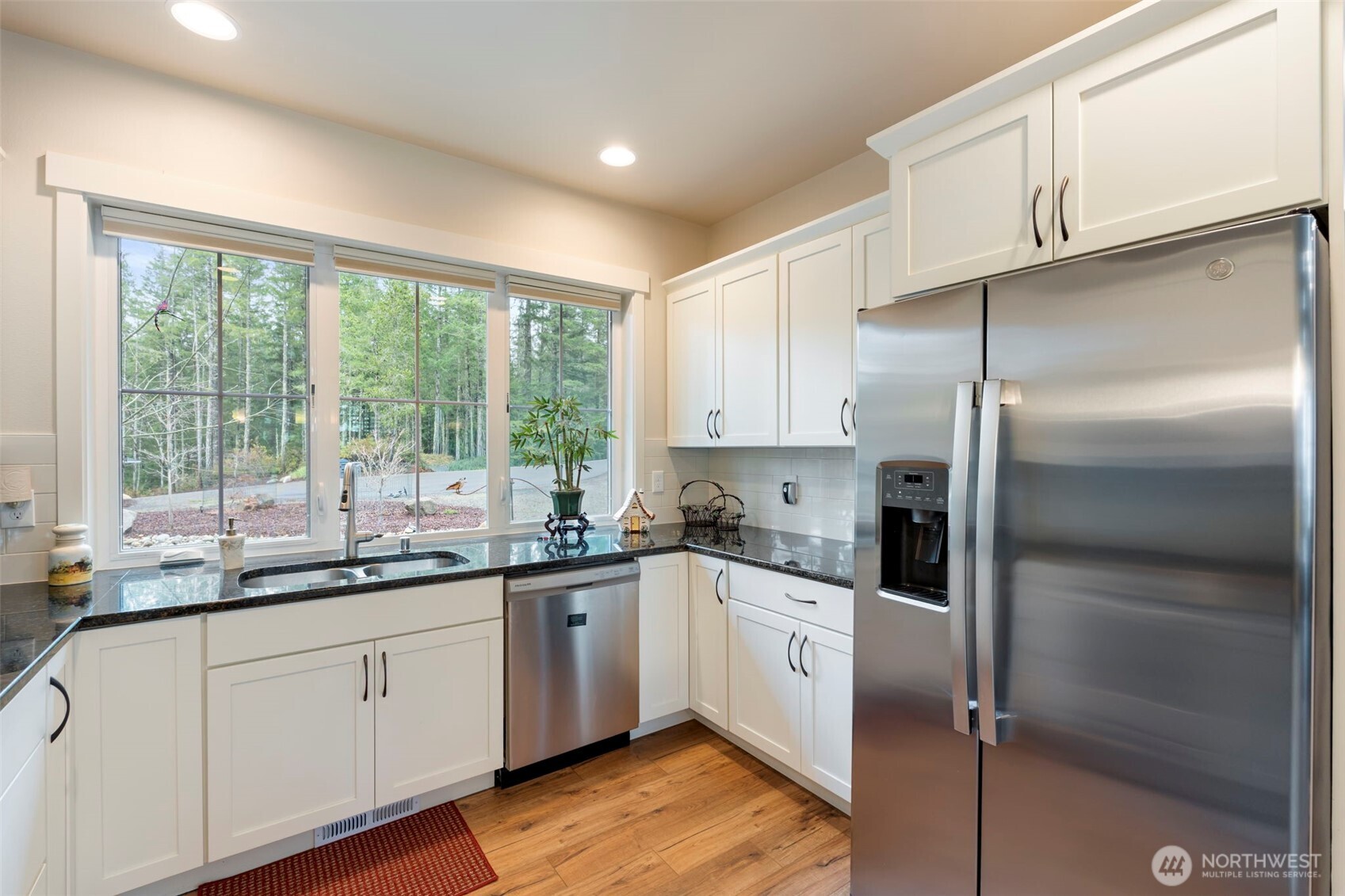 71 East Hemlock Court Union, WA 98592 - Photo 8 of 32 a kitchen with a sink a refrigerator and window