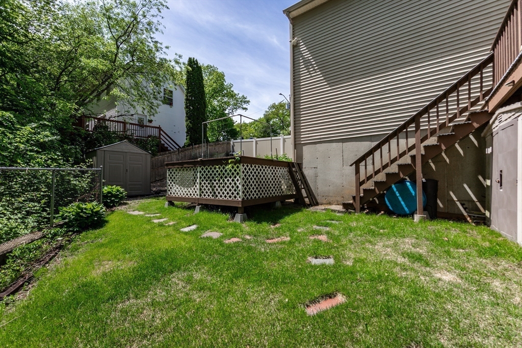 63 Bow Street Saugus, MA 01906 - Photo 38 of 42 a view of backyard with deck and garden
