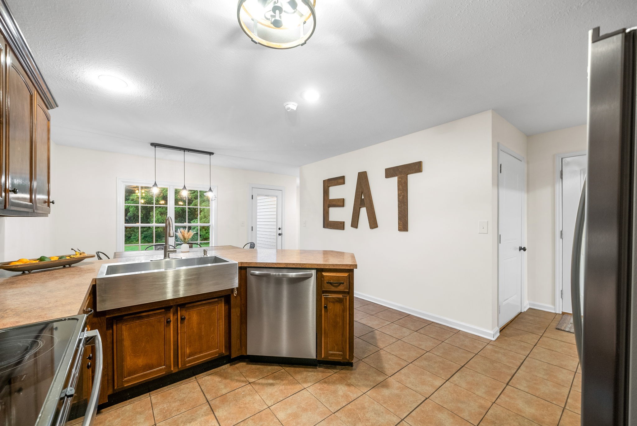 2625 Ford Road Adams, TN 37010 - Photo 8 of 34 a kitchen with a sink and a stove top oven