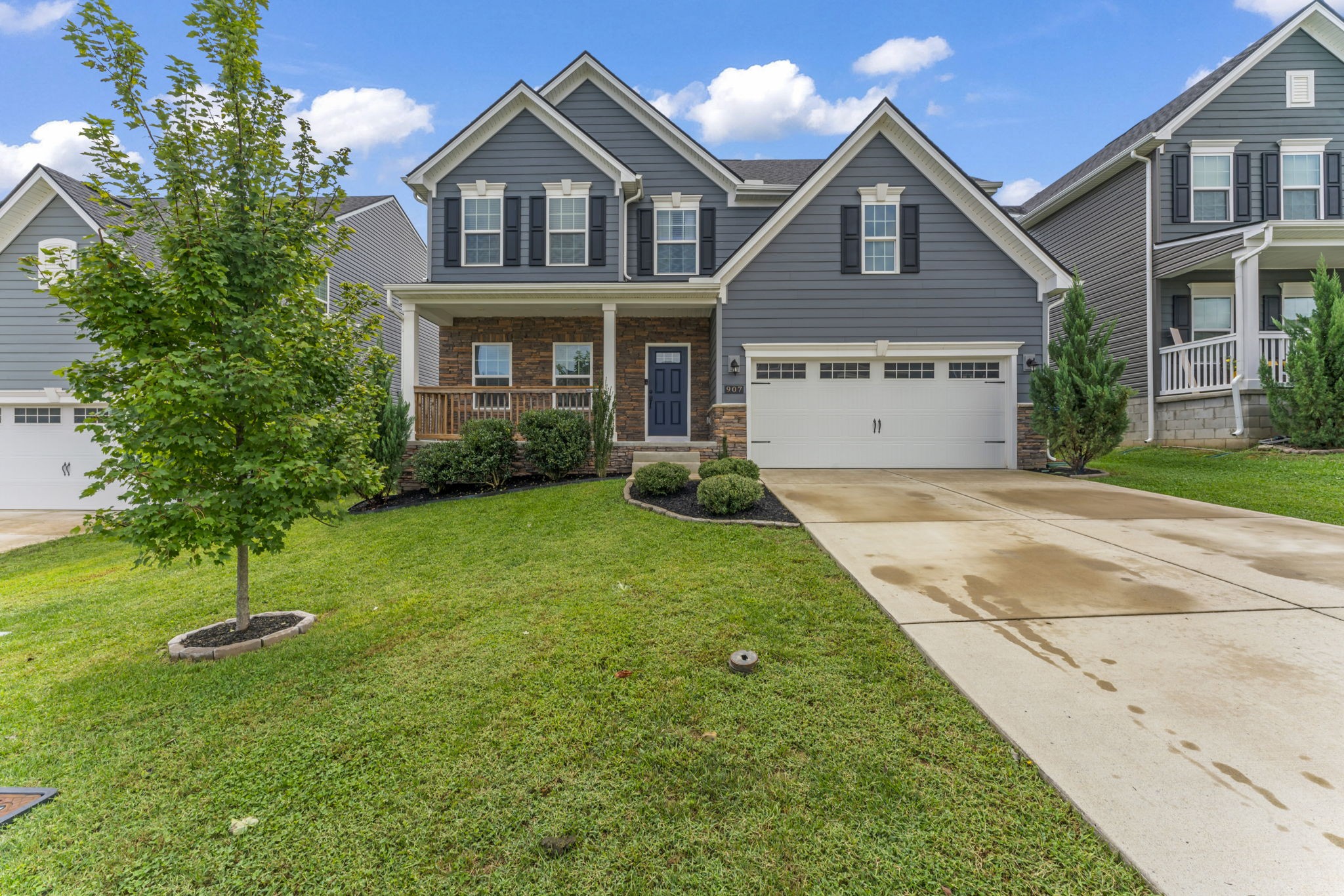 907 Caywood Road Smyrna, TN 37167 - Photo 1 of 32 a front view of a house with a yard and garage