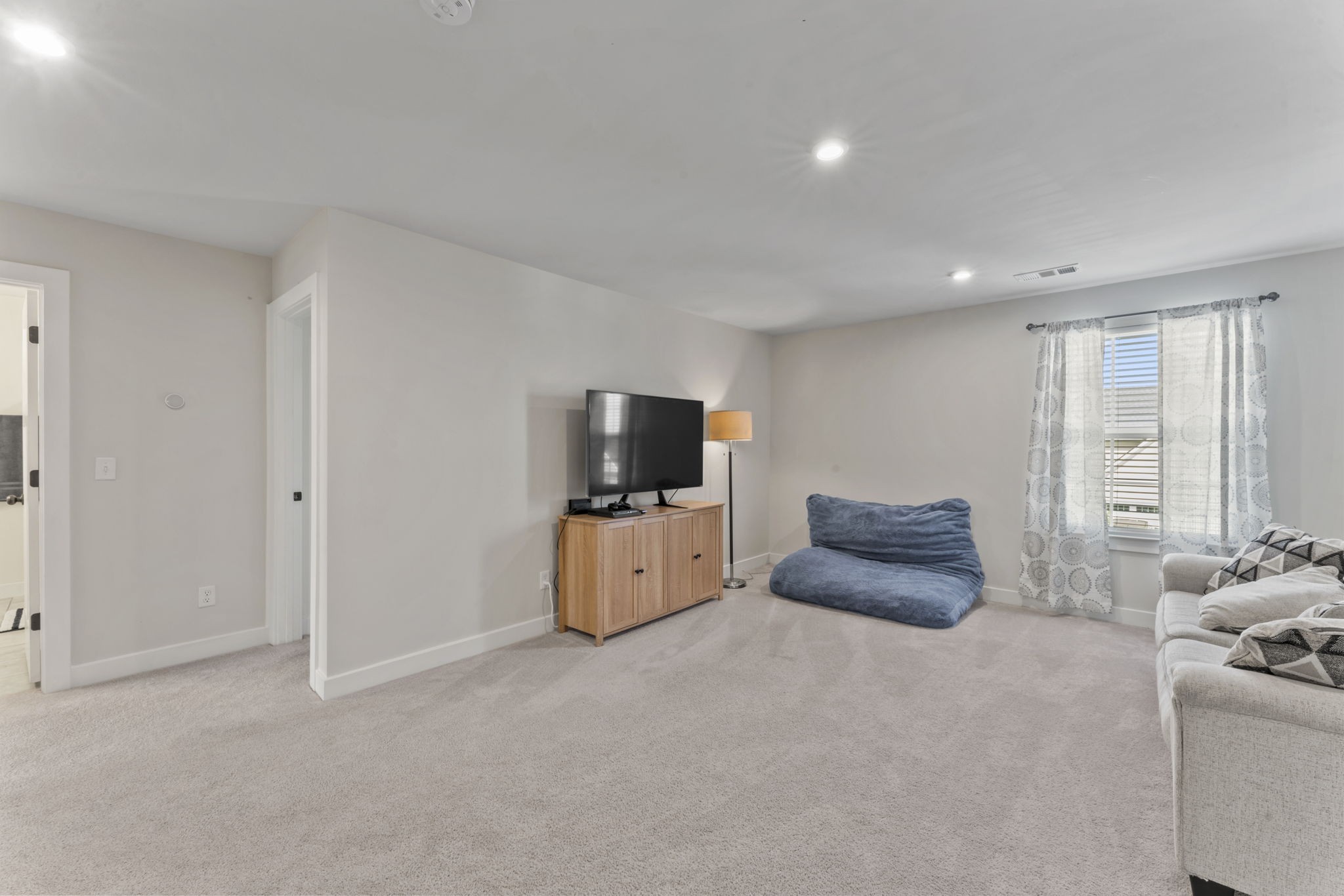 907 Caywood Road Smyrna, TN 37167 - Photo 17 of 32 a living room with furniture and a flat screen tv