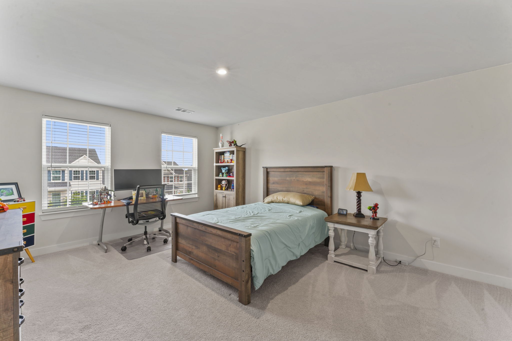 907 Caywood Road Smyrna, TN 37167 - Photo 18 of 32 a bedroom with a bed and a desk