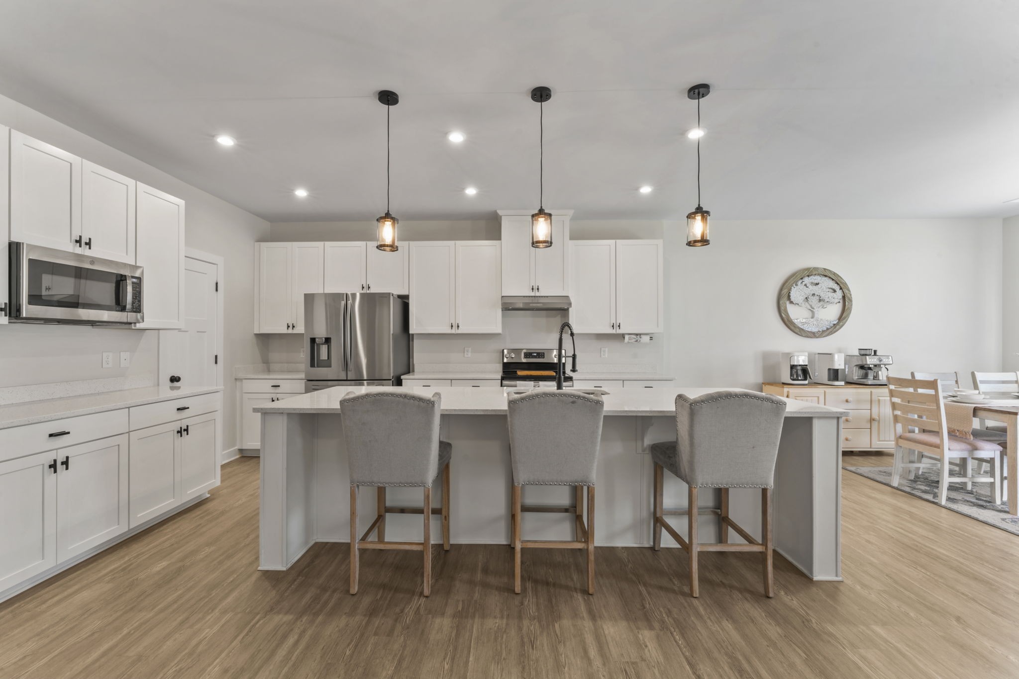 907 Caywood Road Smyrna, TN 37167 - Photo 2 of 32 a kitchen with stainless steel appliances kitchen island granite countertop a table chairs and a view of living room