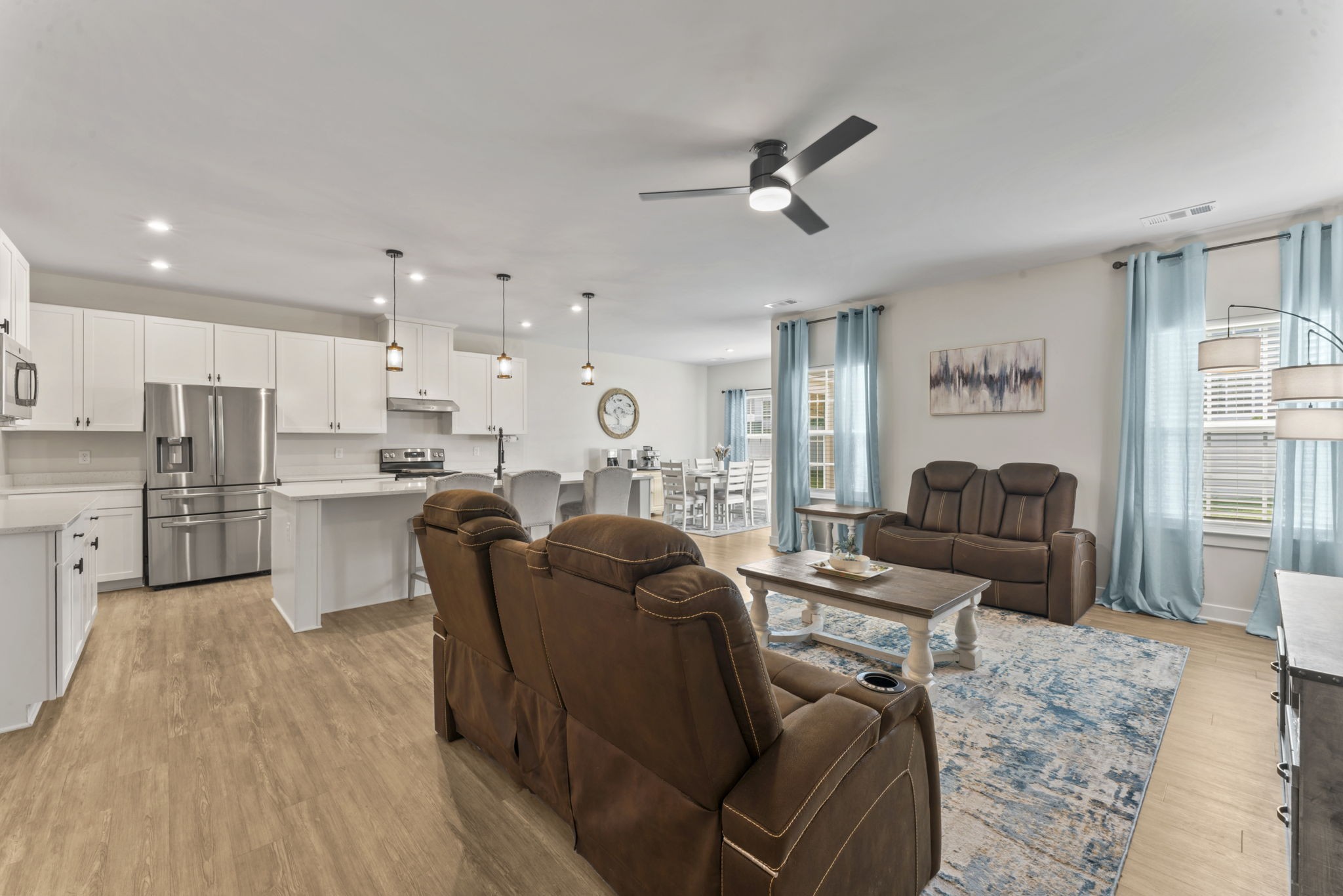 907 Caywood Road Smyrna, TN 37167 - Photo 6 of 32 a living room kitchen with stainless steel appliances furniture and a rug