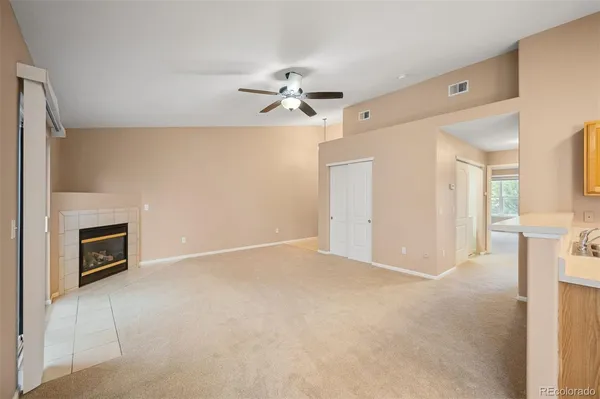 wooden floor in an empty room with a fireplace