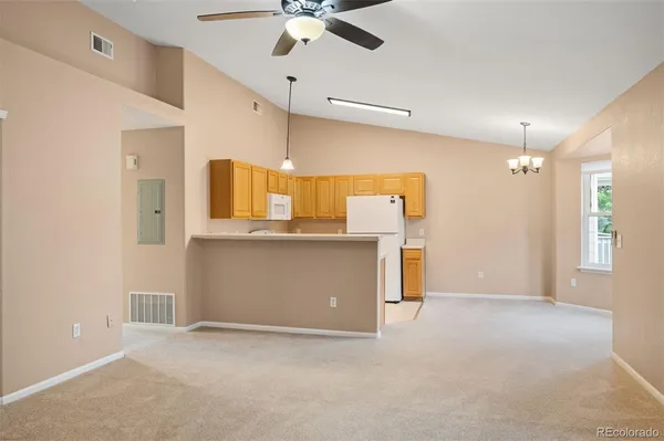 an empty room with a ceiling fan