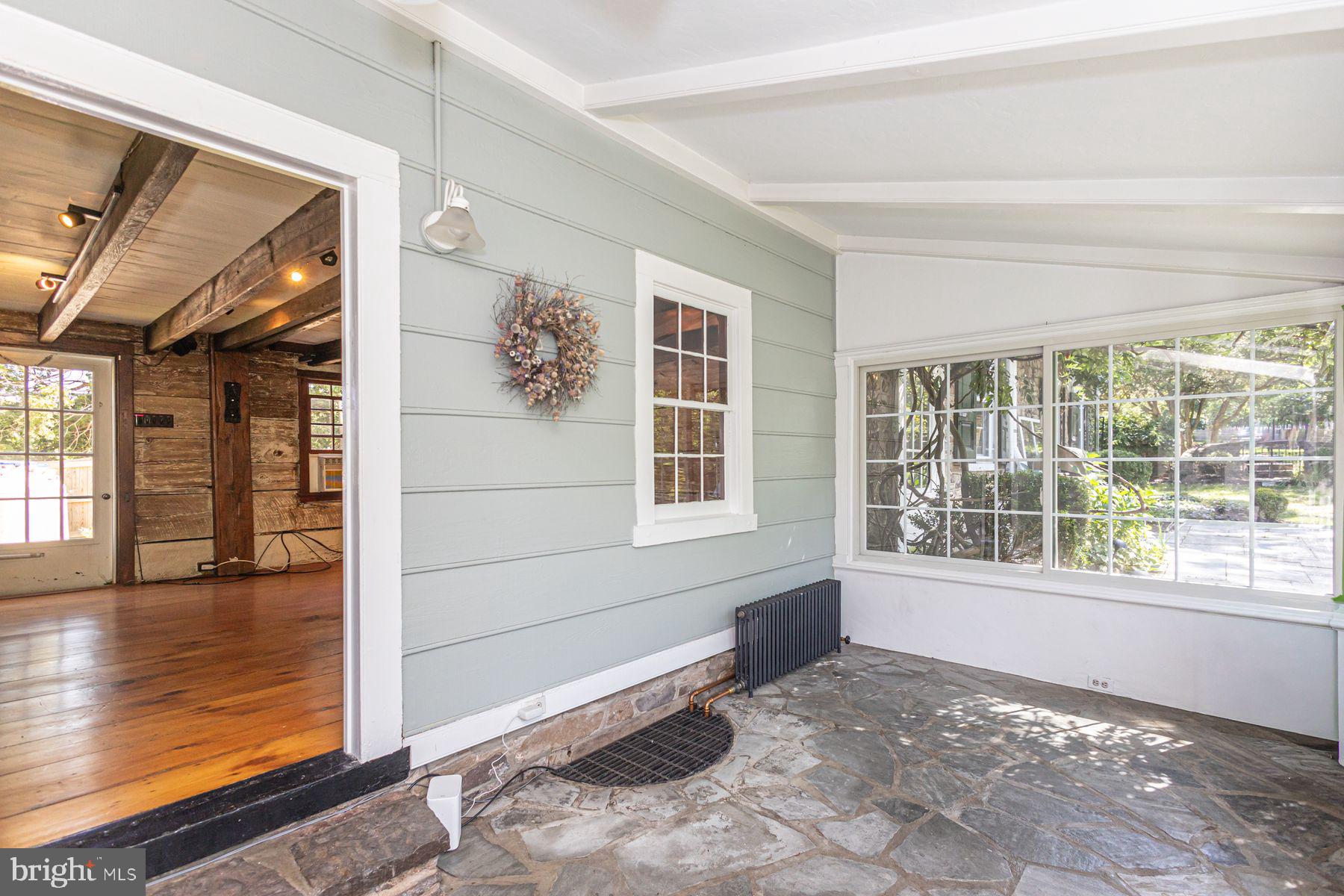 5925 Carversville Road Doylestown, PA 18902 - Photo 12 of 44 a view of a livingroom with wooden floor and windows