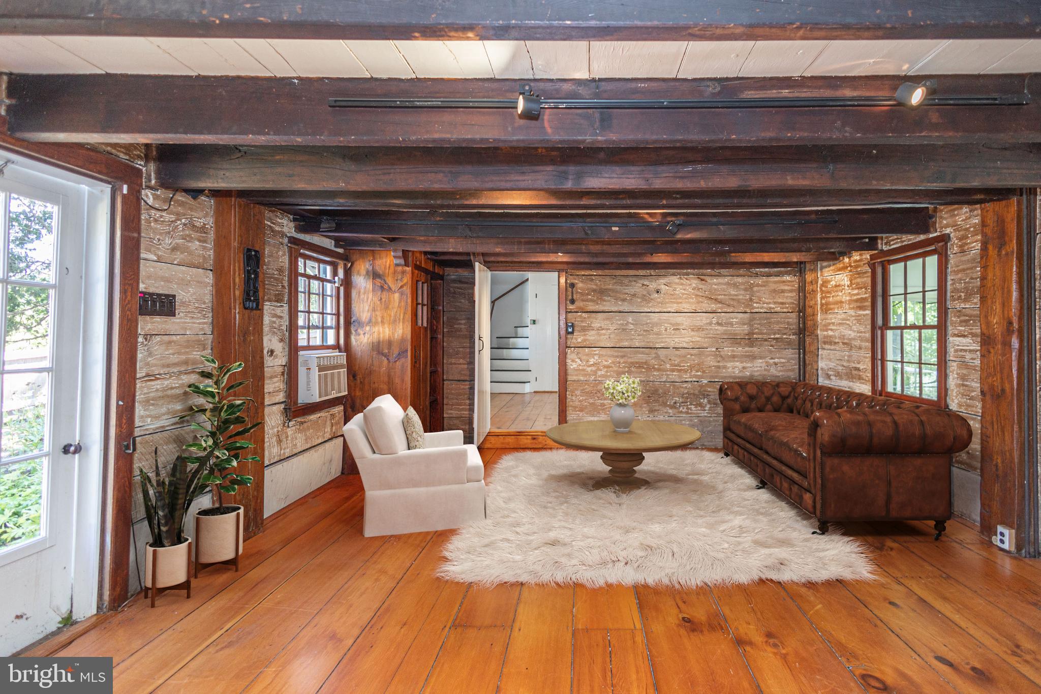 5925 Carversville Road Doylestown, PA 18902 - Photo 13 of 44 a living room with furniture and a potted plant
