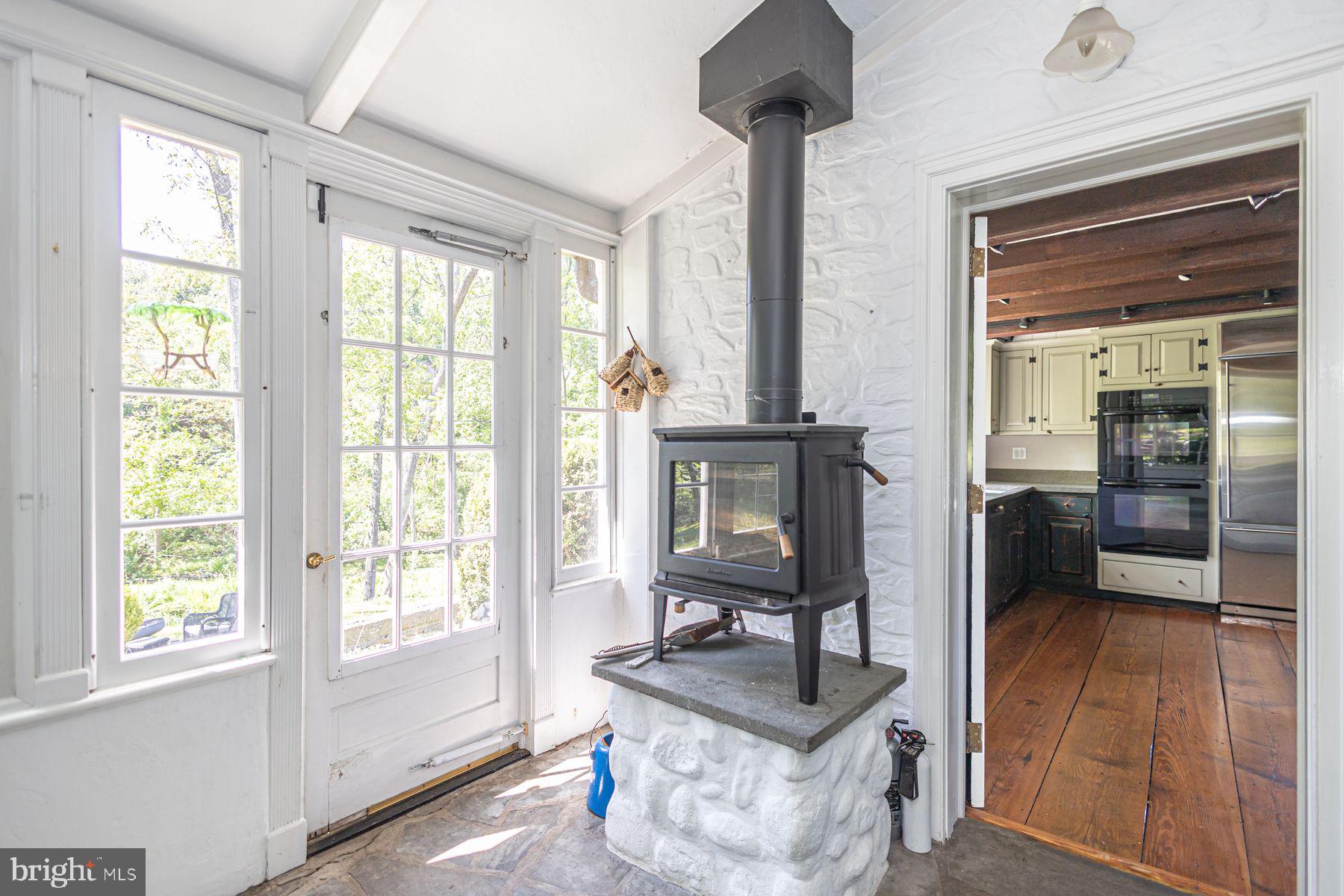 5925 Carversville Road Doylestown, PA 18902 - Photo 17 of 44 a living room with furniture and a window