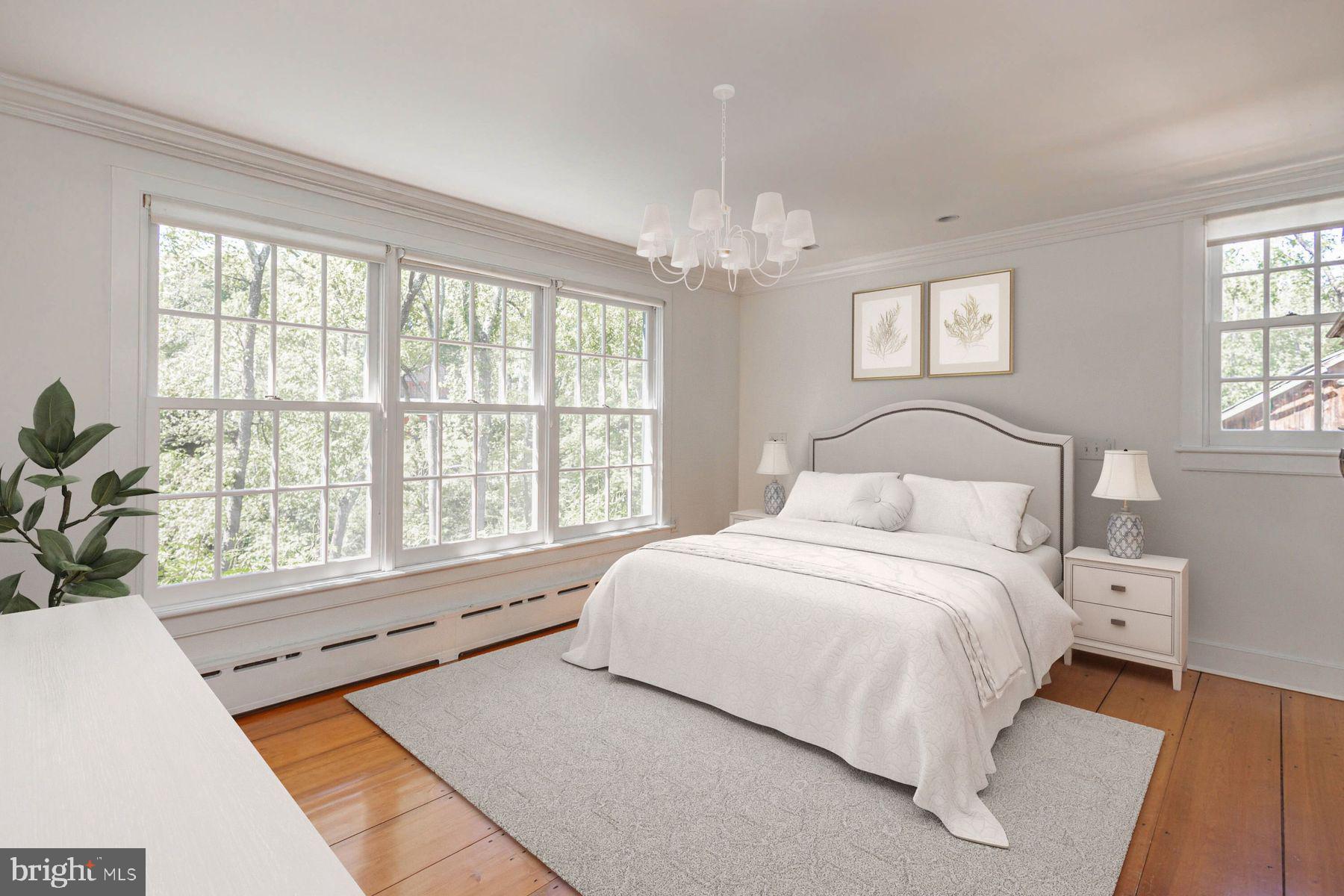 5925 Carversville Road Doylestown, PA 18902 - Photo 19 of 44 a bedroom with a large bed and a large window