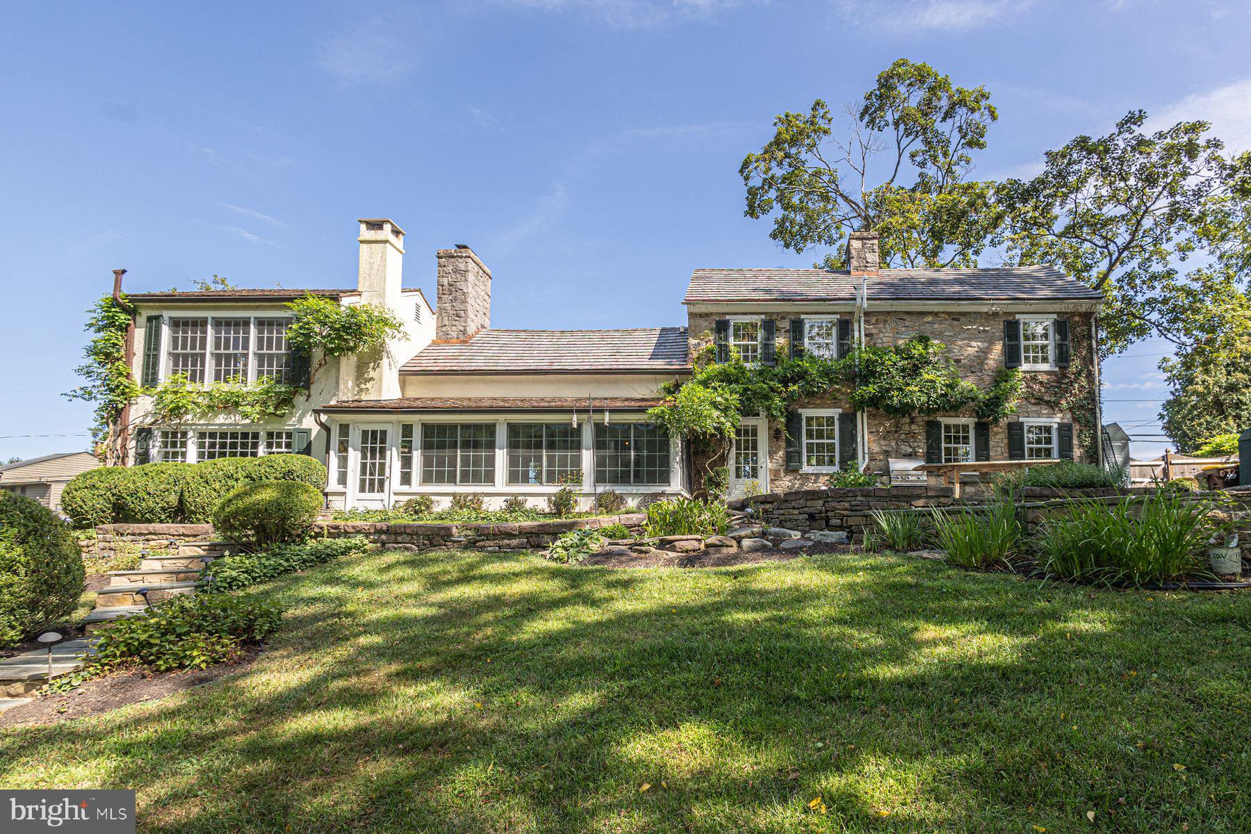 5925 Carversville Road Doylestown, PA 18902 - Photo 2 of 44 a front view of a house with a garden