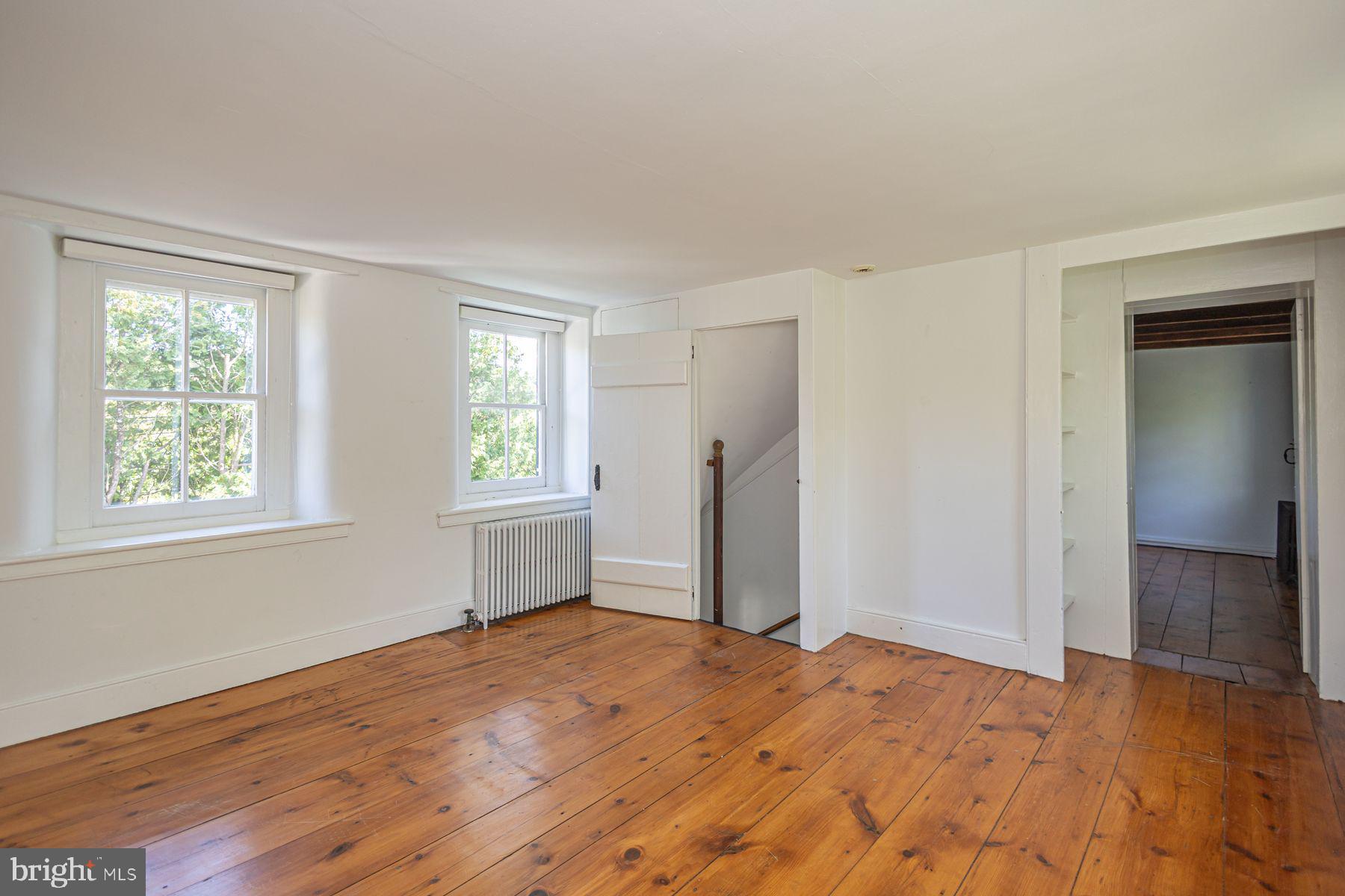 5925 Carversville Road Doylestown, PA 18902 - Photo 22 of 44 a view of empty room with wooden floor and fan