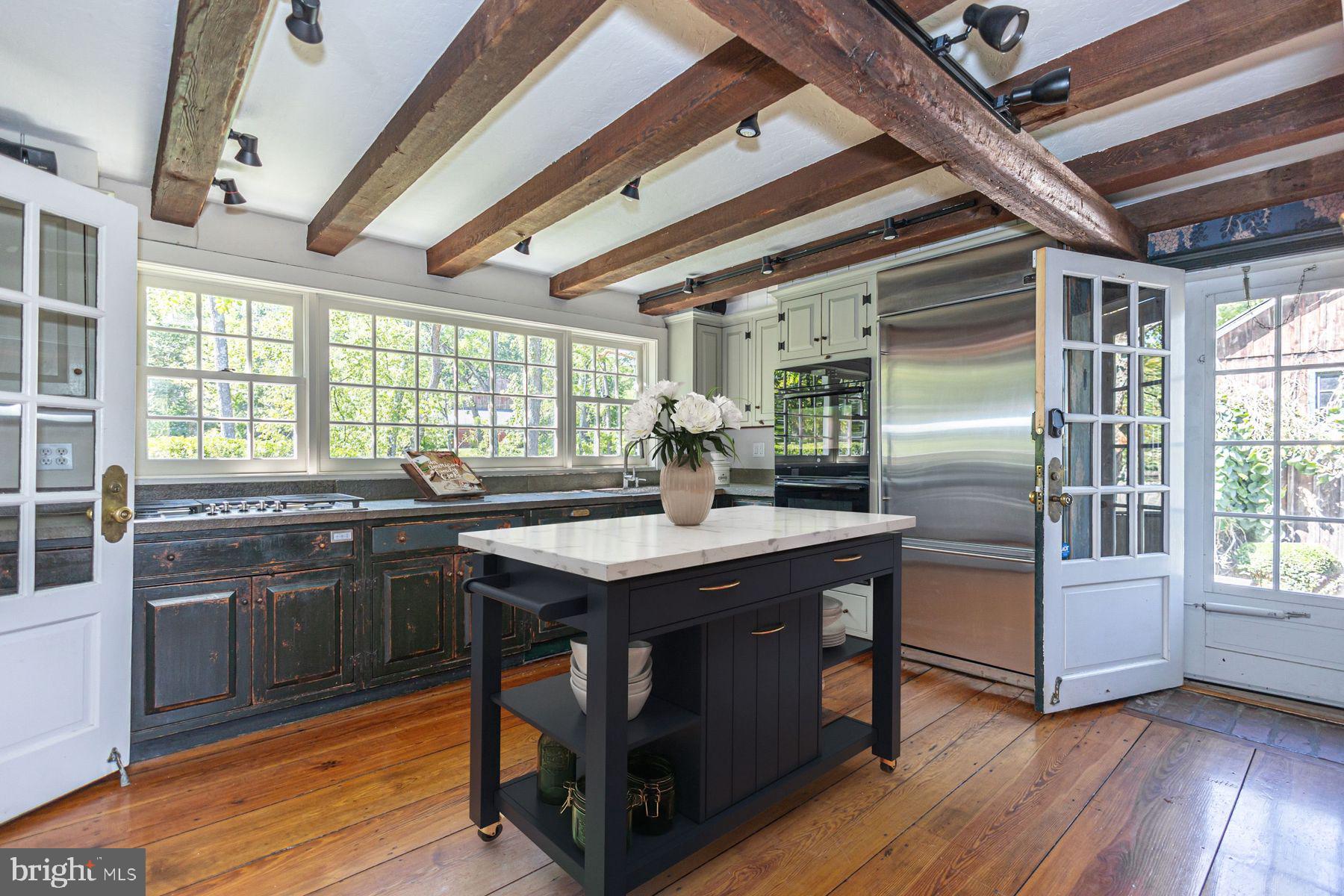 5925 Carversville Road Doylestown, PA 18902 - Photo 7 of 44 a kitchen with stainless steel appliances granite countertop a stove and a refrigerator