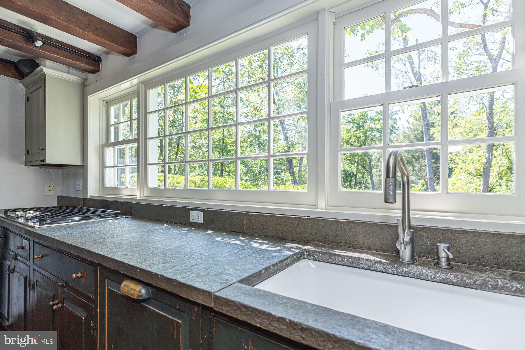 5925 Carversville Road Doylestown, PA 18902 - Photo 9 of 44 a kitchen with granite countertop a sink and a window
