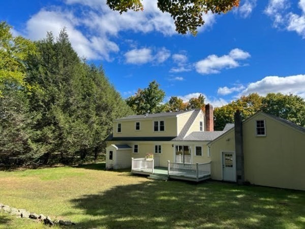 288 Sugar Road Bolton, MA 01740 - Photo 2 of 13 a view of a house with a big yard