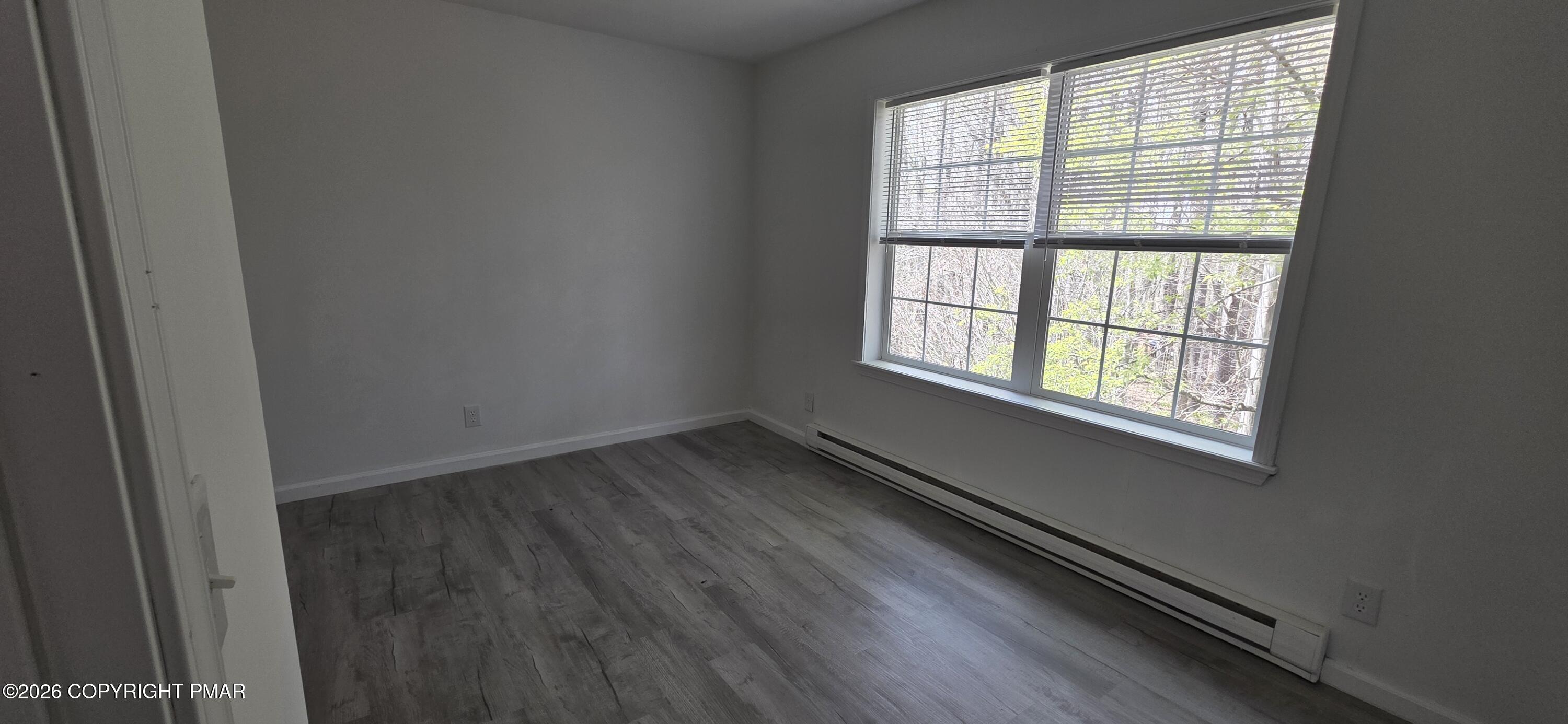 4715 Norwood Lane Tobyhanna, PA 18466 - Photo 6 of 14 an empty room with wooden floor and windows