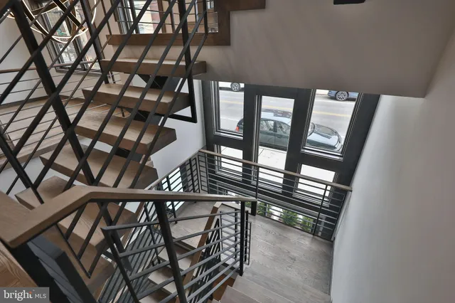 a living room with furniture a dining table and chairs