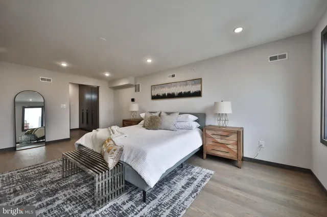 a bathroom with a double vanity sink mirror and shower