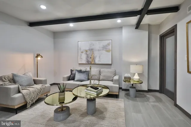 a view of a hallway with seating area