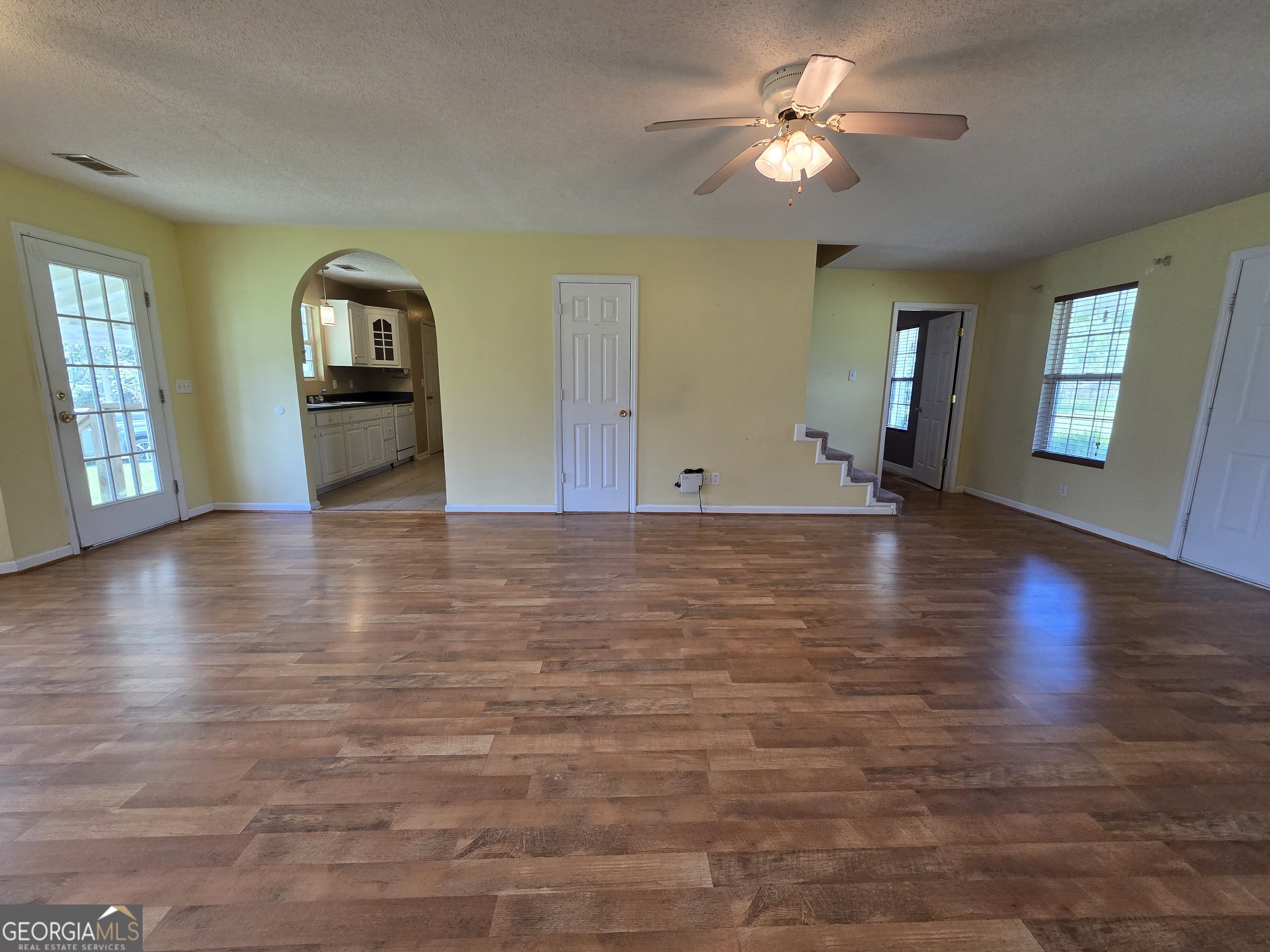 9546 Union Road Metter, GA 30439 - Photo 10 of 45 a view of an empty room with window and wooden floor