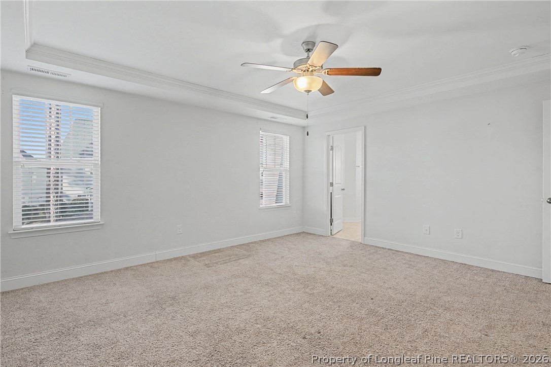 47 Pinnacle Drive Spring Lake, NC 28390 - Photo 21 of 50 a view of an empty room with chandelier fan and window