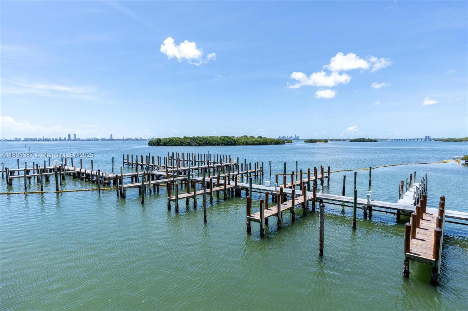 770 Northeast 69th Street, Unit 1B Miami, FL 33138 - Photo 11 of 15 a view of a balcony with dining space and lake view