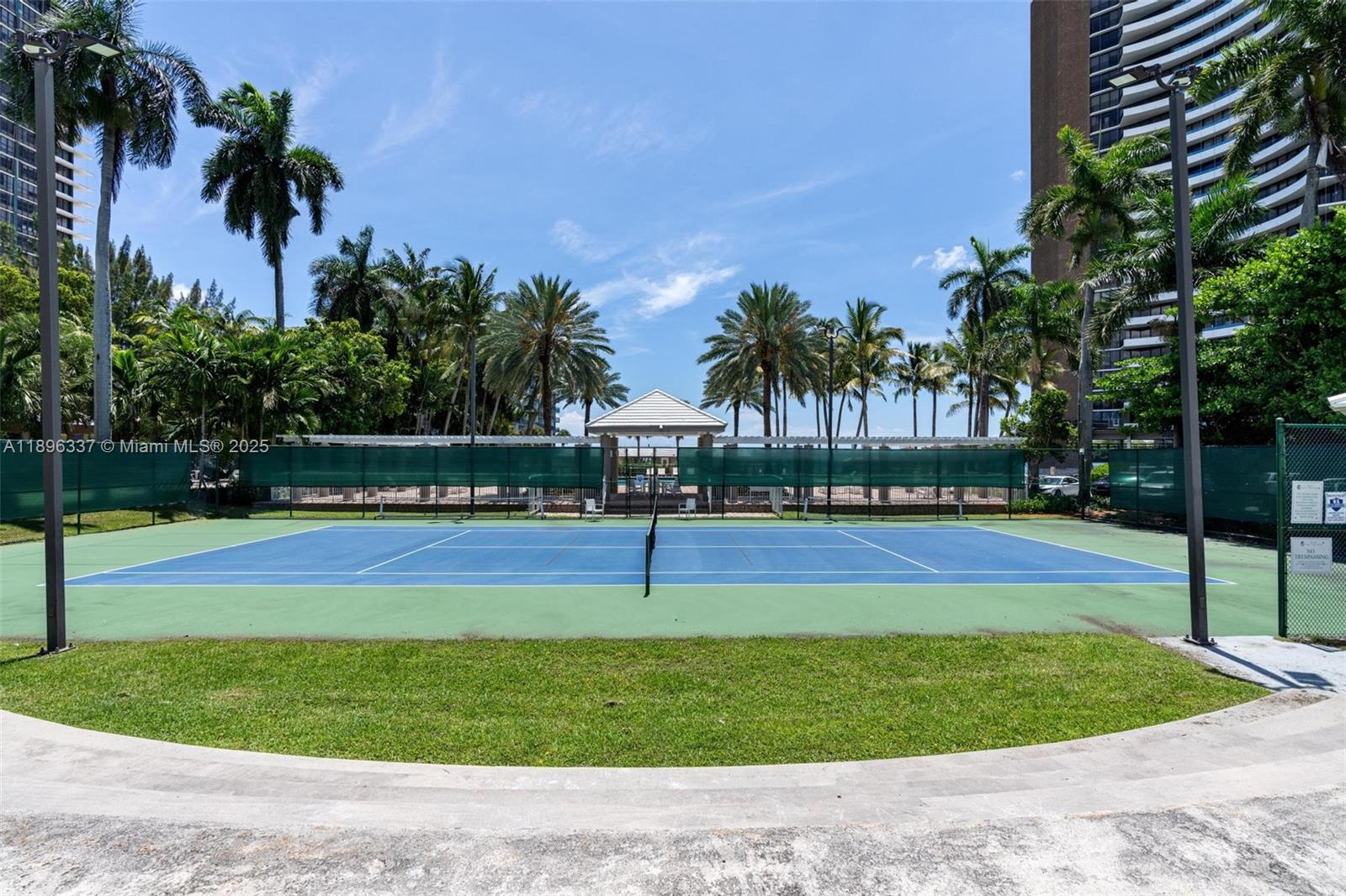770 Northeast 69th Street, Unit 1B Miami, FL 33138 - Photo 14 of 15 a swimming pool with outdoor seating and yard