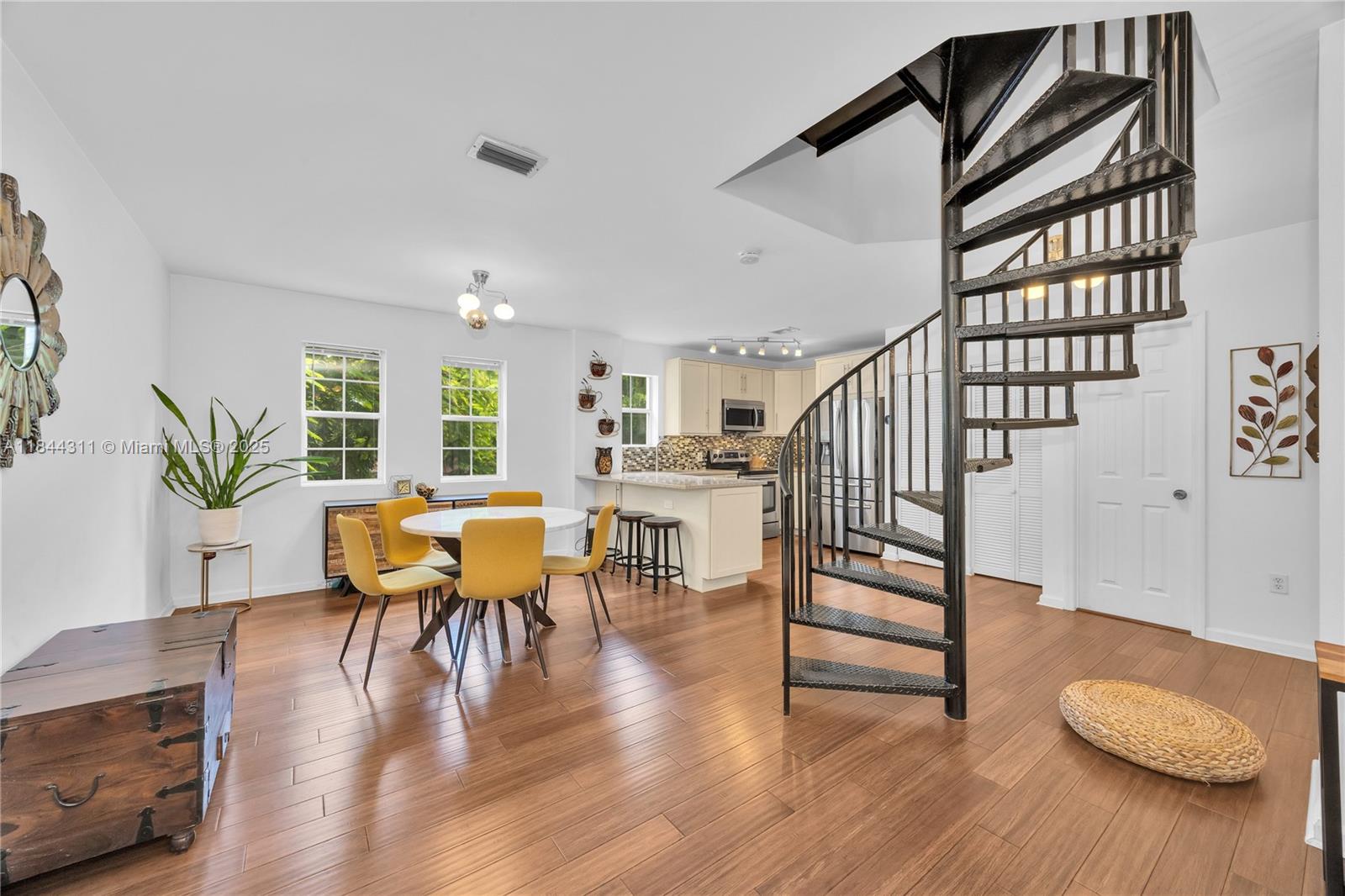 2850 Coconut Avenue, Unit 15 Miami, FL 33133 - Photo 11 of 32 a view of a livingroom with furniture and hardwood floor