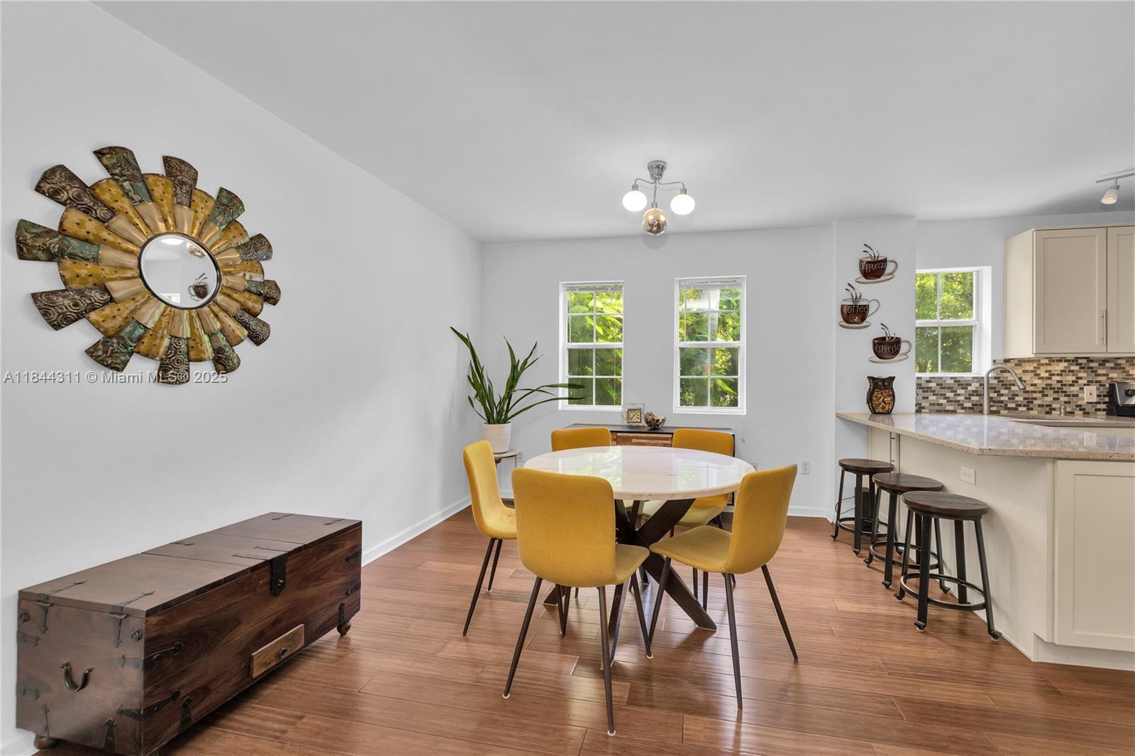 2850 Coconut Avenue, Unit 15 Miami, FL 33133 - Photo 12 of 32 a view of a dining room with furniture window and wooden floor