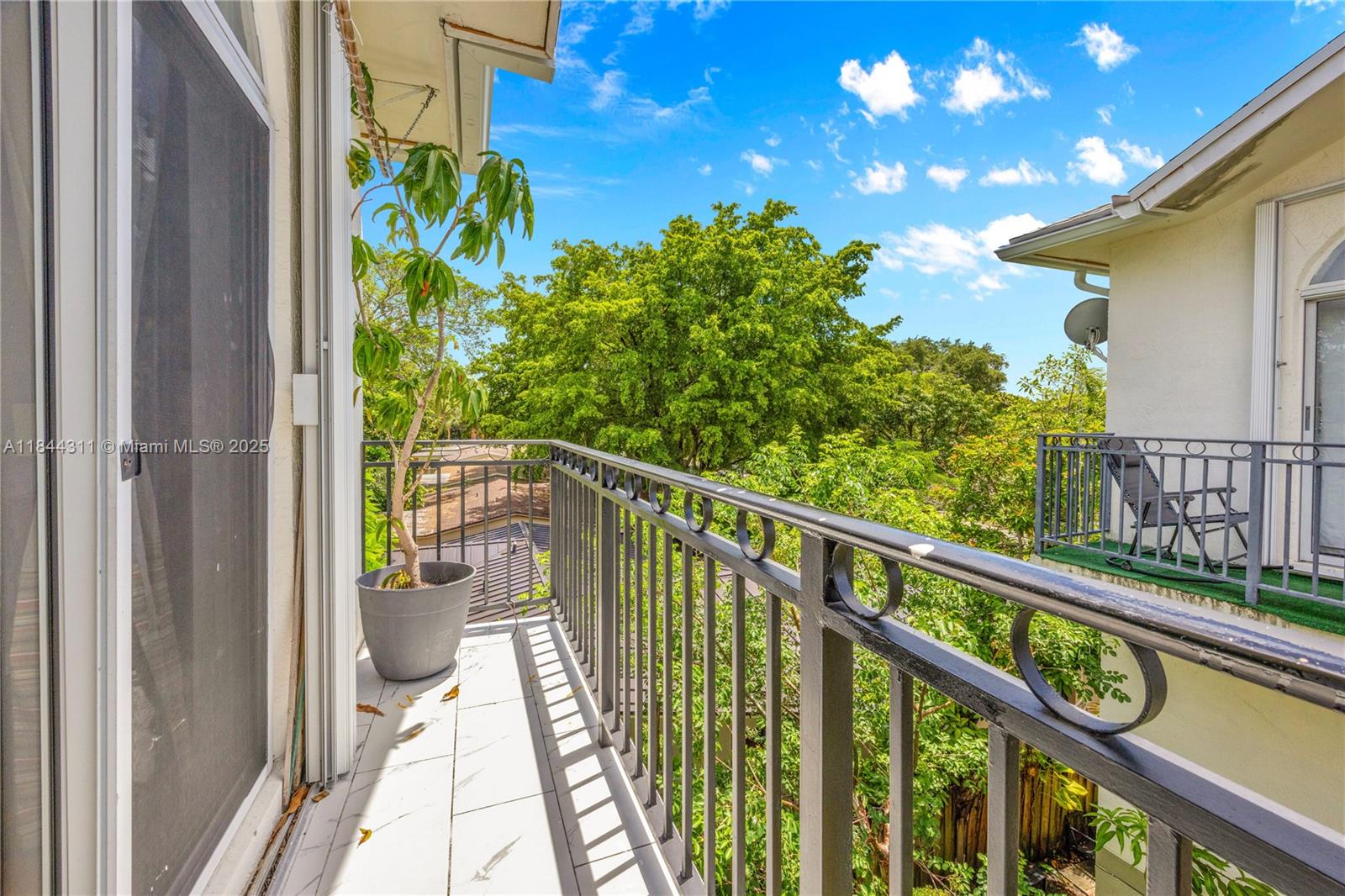 2850 Coconut Avenue, Unit 15 Miami, FL 33133 - Photo 27 of 32 a view of a balcony with wooden floor