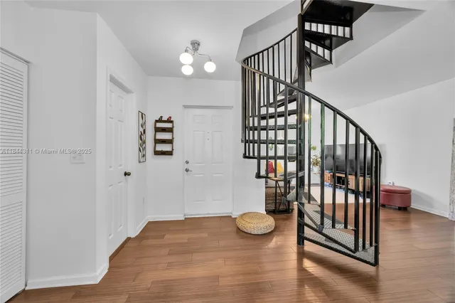 a view of entryway with wooden floor