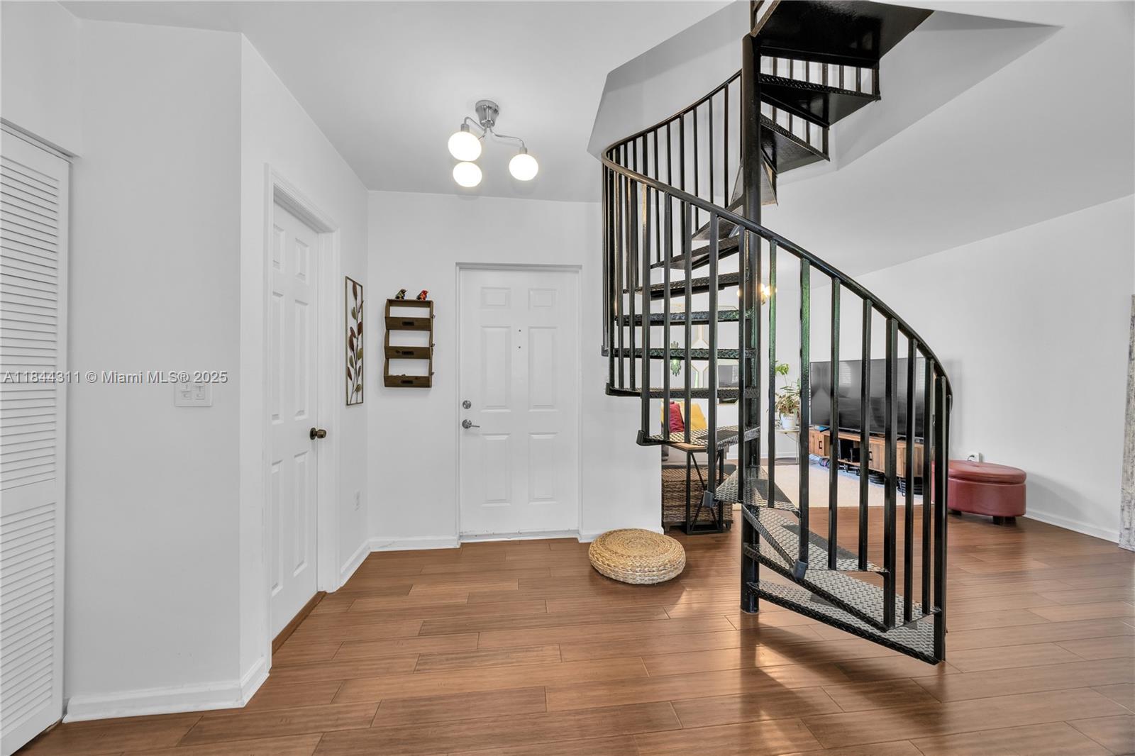 2850 Coconut Avenue, Unit 15 Miami, FL 33133 - Photo 5 of 32 a view of entryway with wooden floor