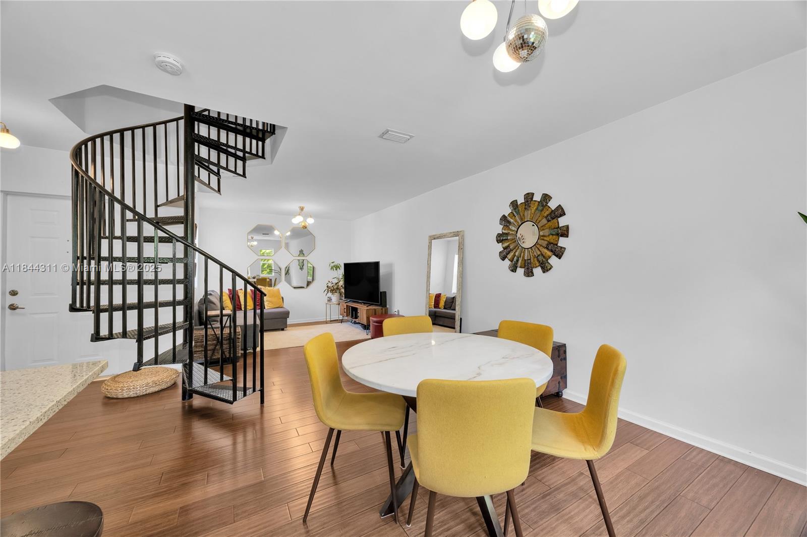 2850 Coconut Avenue, Unit 15 Miami, FL 33133 - Photo 7 of 32 a view of a dining room with furniture and wooden floor