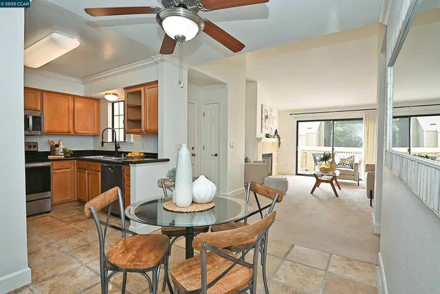 a kitchen with stainless steel appliances a stove sink microwave and cabinets