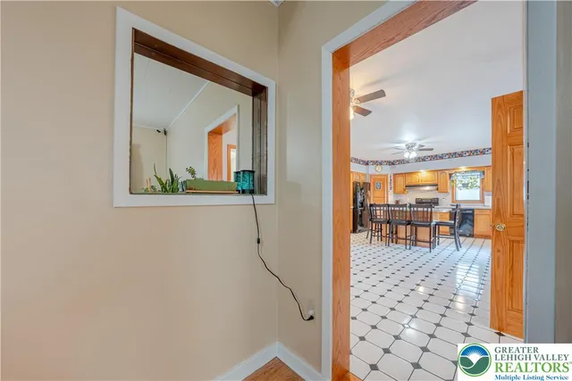 a large kitchen with stainless steel appliances granite countertop a stove a sink and a microwave