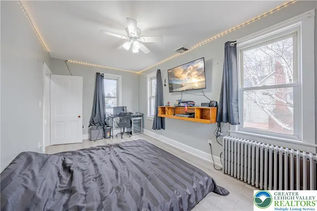 a view of house with a yard