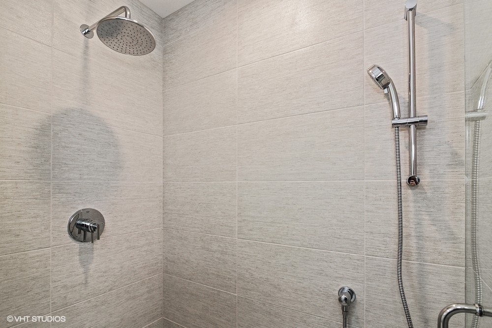 3326 West Irving Park Road, Unit 3E Chicago, IL 60618 - Photo 11 of 15 a bathroom with a shower