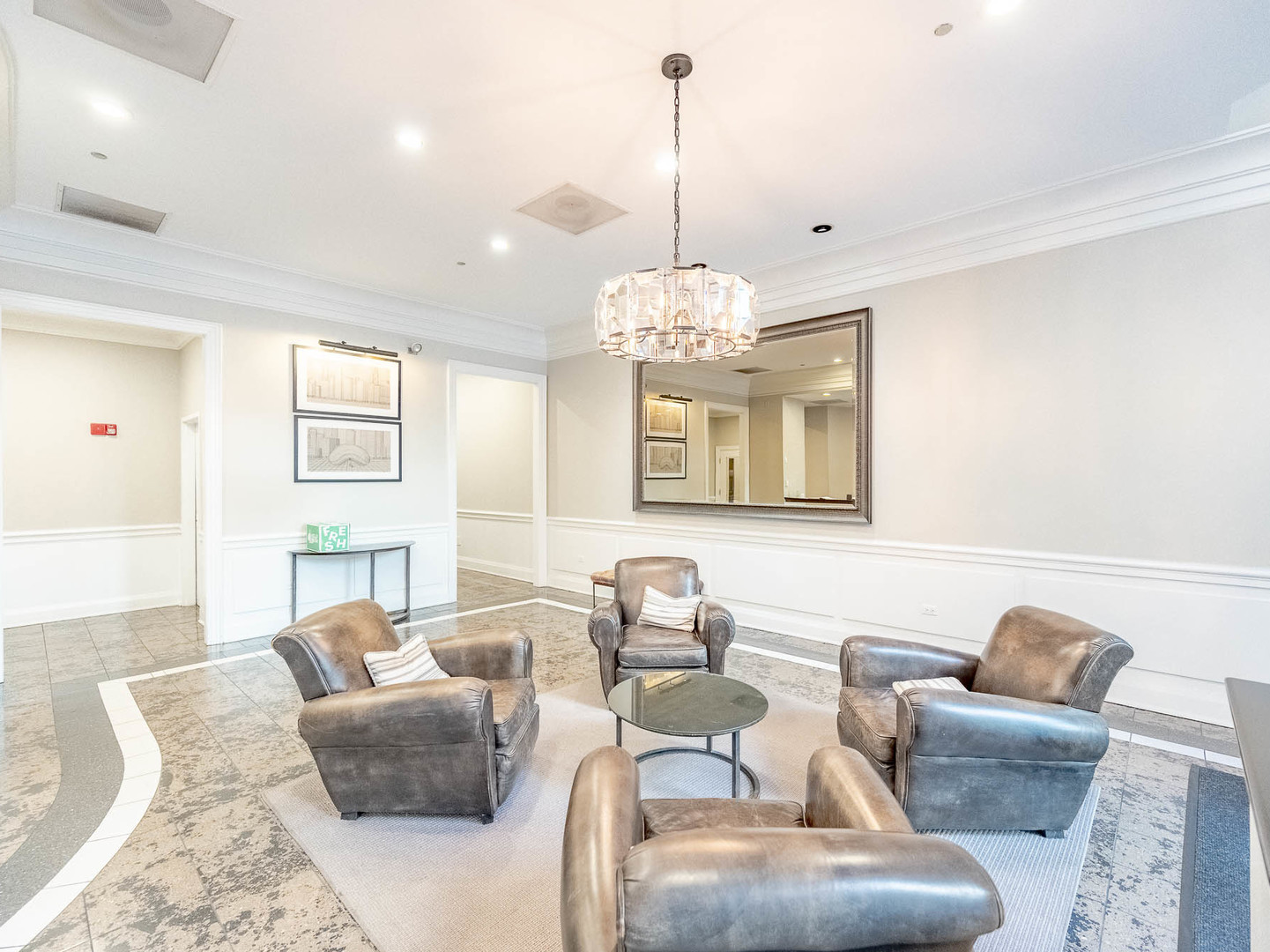 630 North State Street, Unit 2204 Chicago, IL 60654 - Photo 3 of 13 a living room with furniture chandelier and a view of kitchen