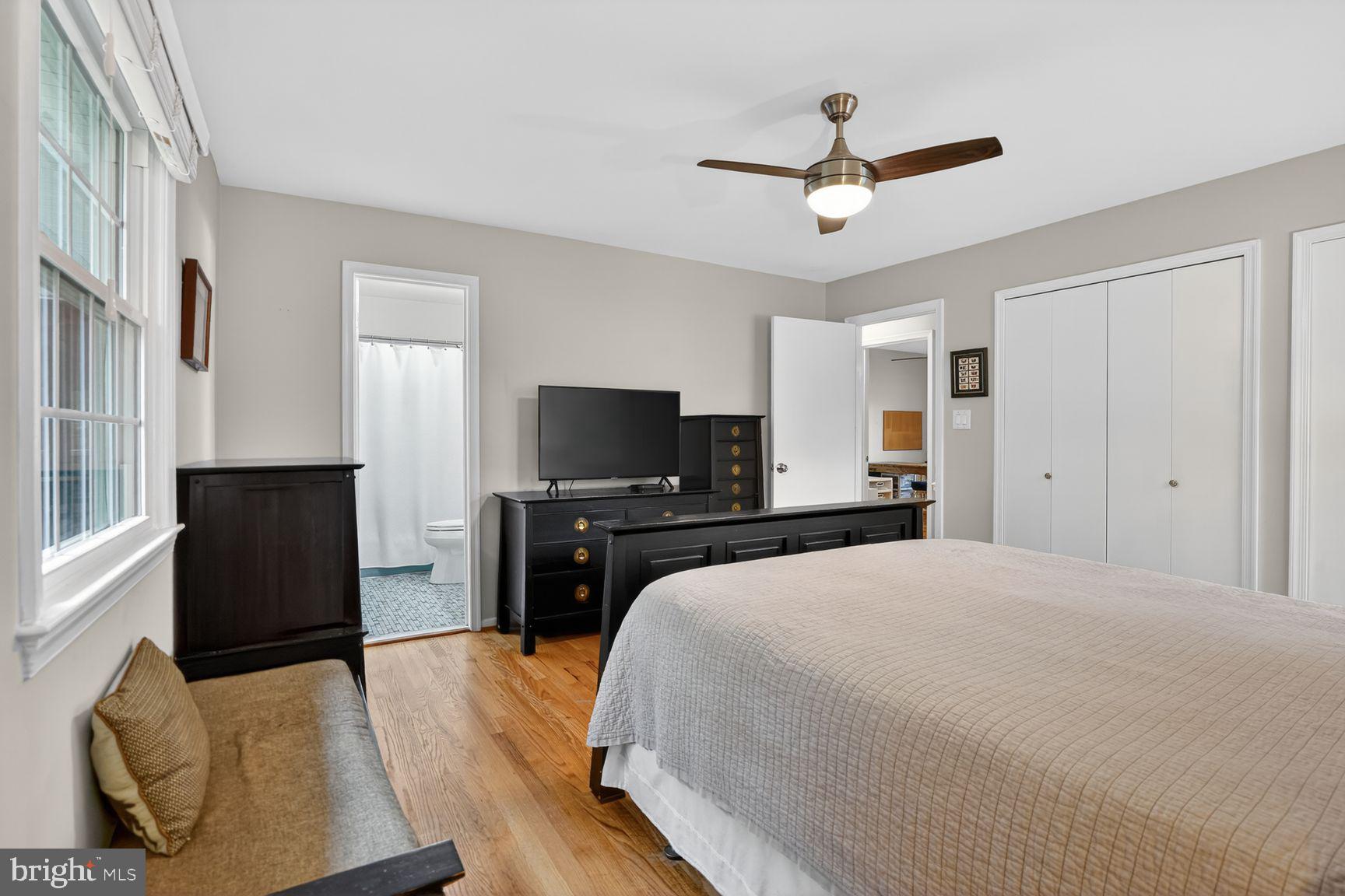 5024 Portsmouth Road Fairfax, VA 22032 - Photo 17 of 38 a bedroom with a bed and a flat screen television