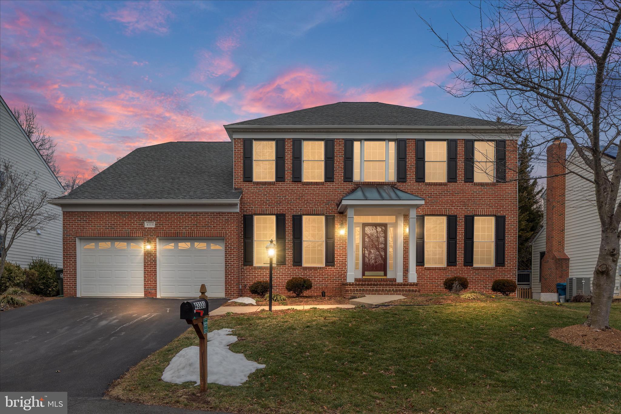 43331 Ritter Lane South Riding, VA 20152 - Photo 1 of 55 a front view of a house with a garden