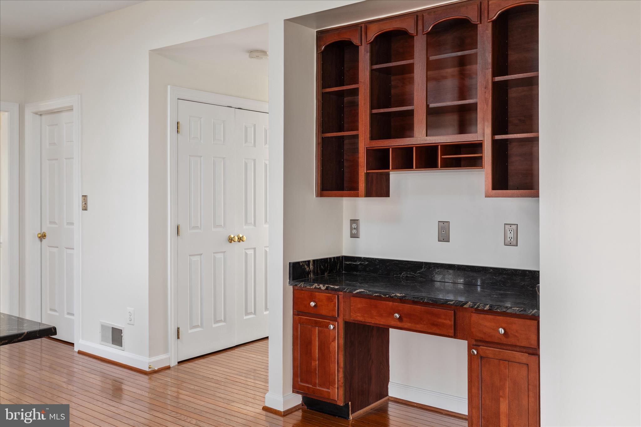 43331 Ritter Lane South Riding, VA 20152 - Photo 15 of 55 a view of a kitchen with granite countertop cabinets and wooden floor