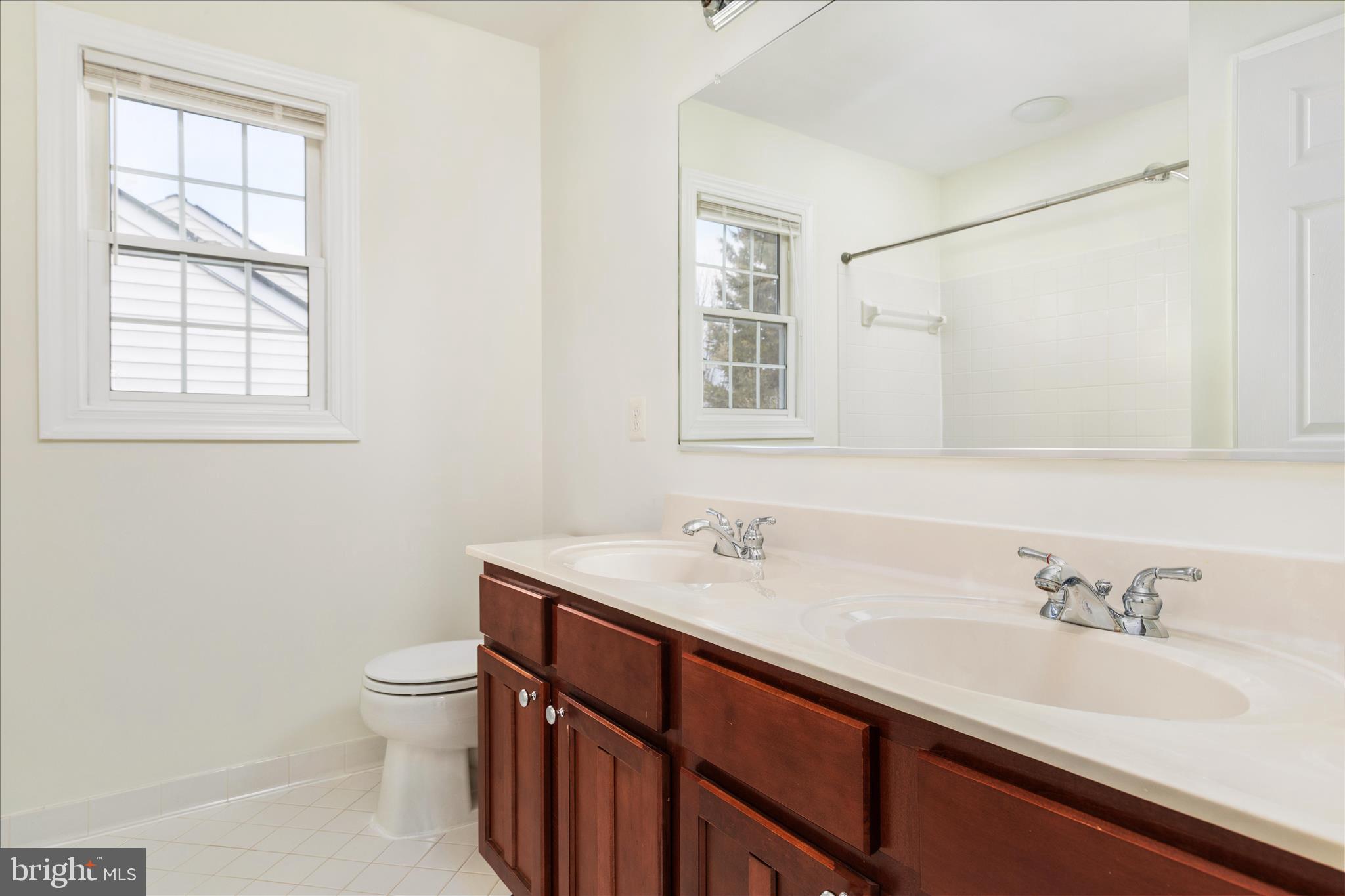 43331 Ritter Lane South Riding, VA 20152 - Photo 22 of 55 a bathroom with a sink toilet and vanity