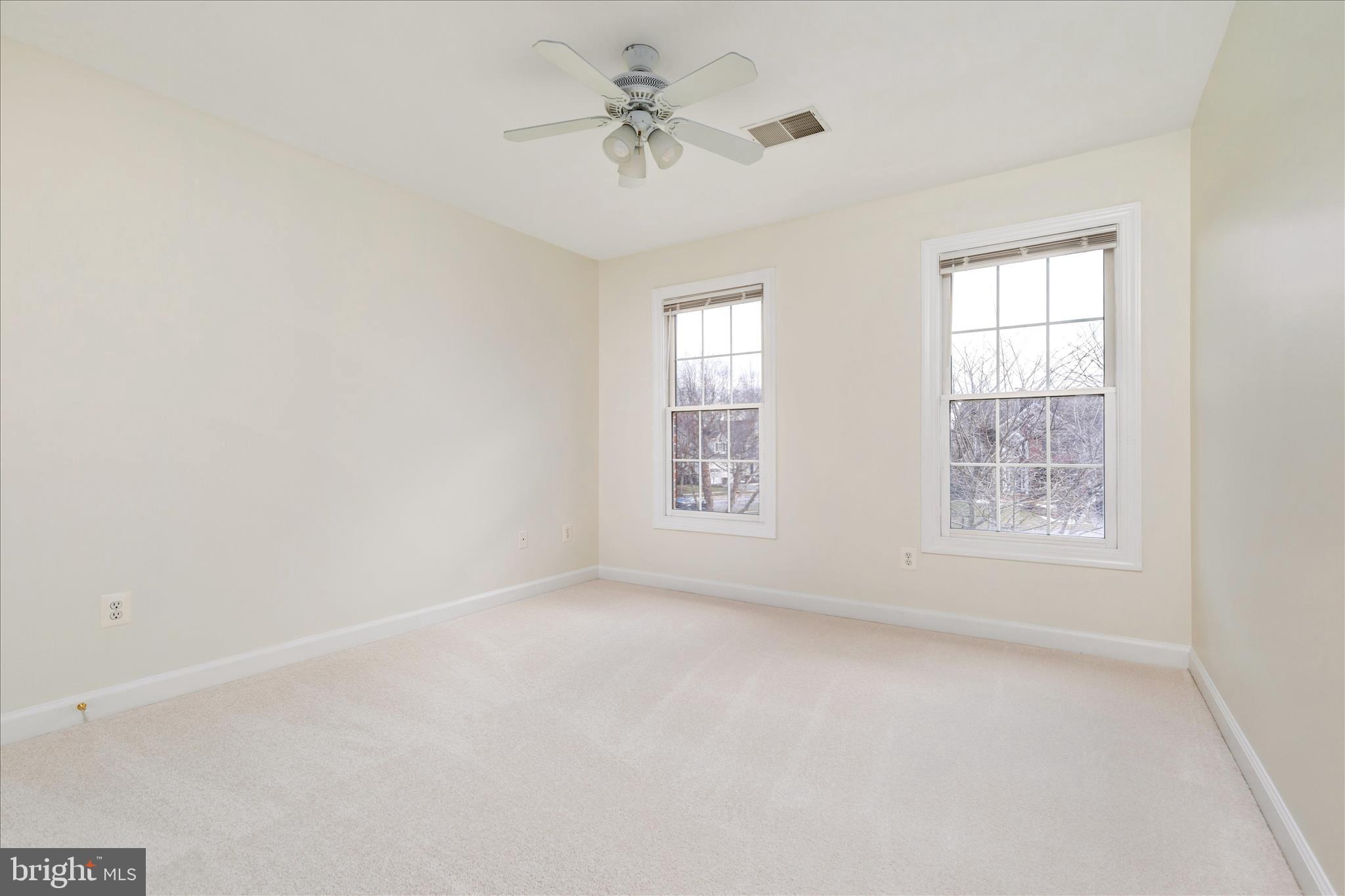 43331 Ritter Lane South Riding, VA 20152 - Photo 23 of 55 an empty room with windows and chandelier fan