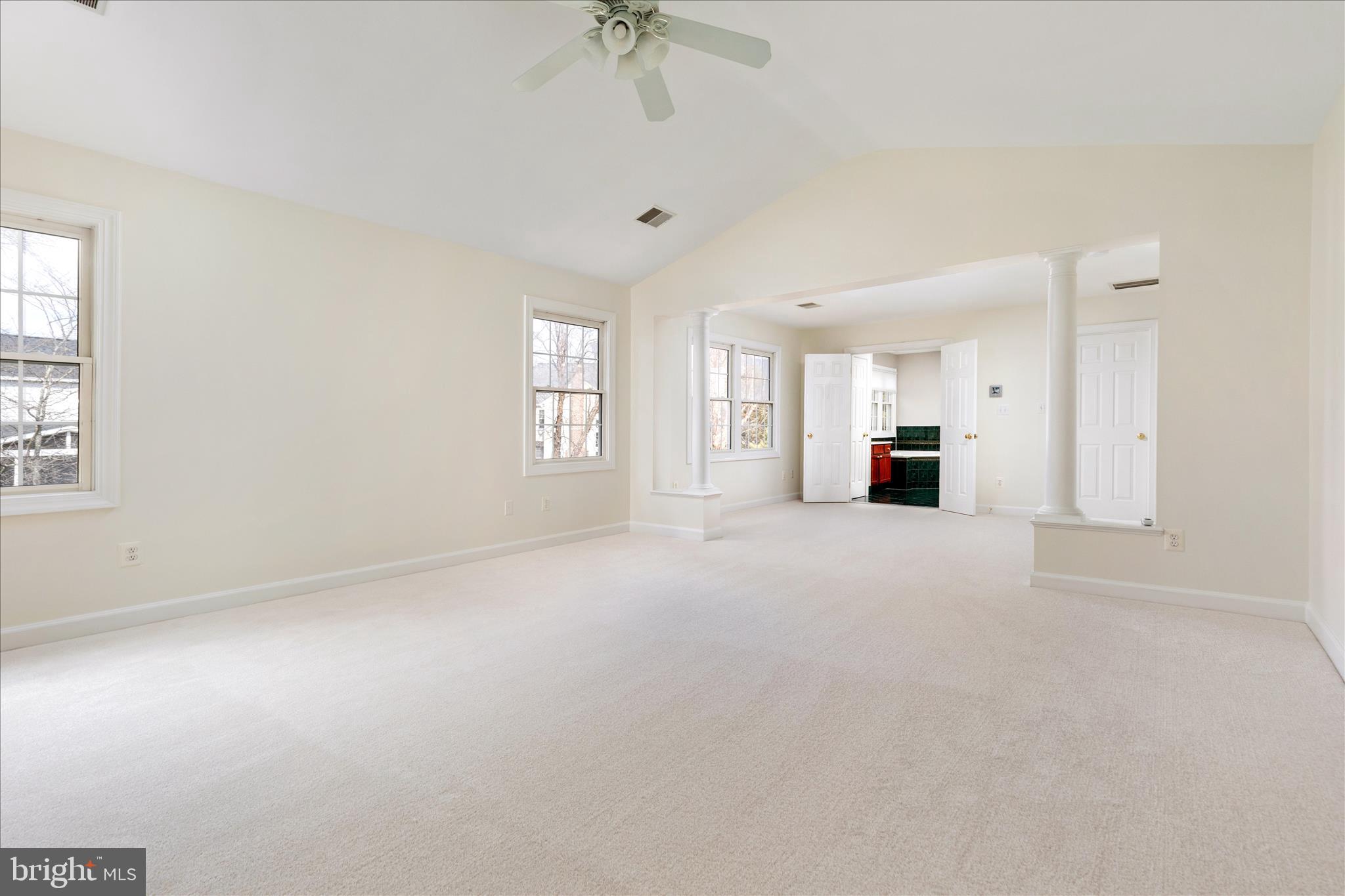43331 Ritter Lane South Riding, VA 20152 - Photo 27 of 55 an empty room with windows and chandelier fan