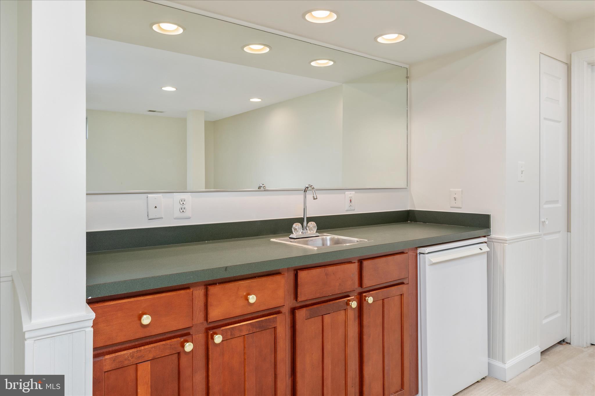 43331 Ritter Lane South Riding, VA 20152 - Photo 35 of 55 a kitchen with a sink and cabinets