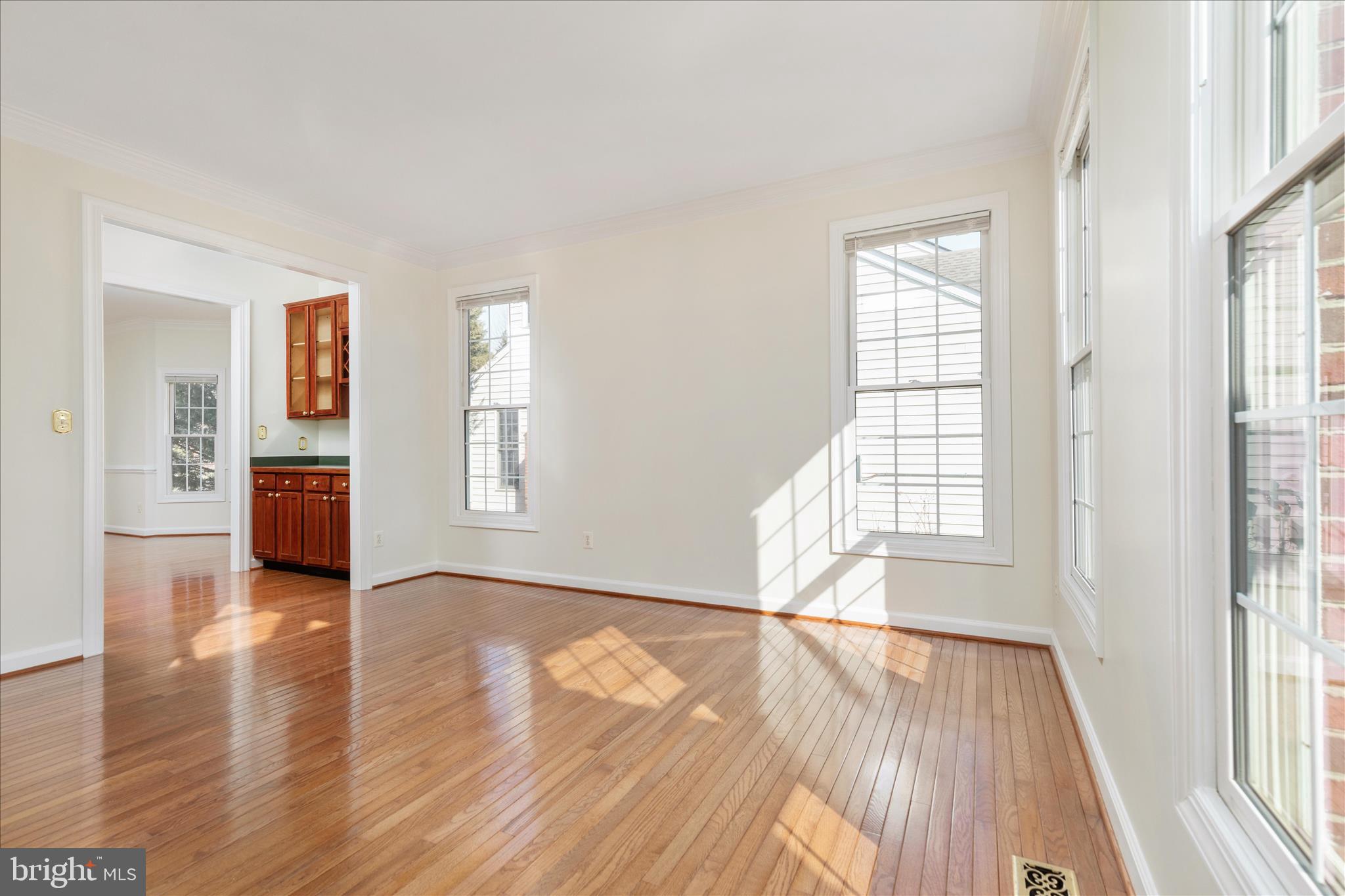 43331 Ritter Lane South Riding, VA 20152 - Photo 6 of 55 an empty room with wooden floor and windows