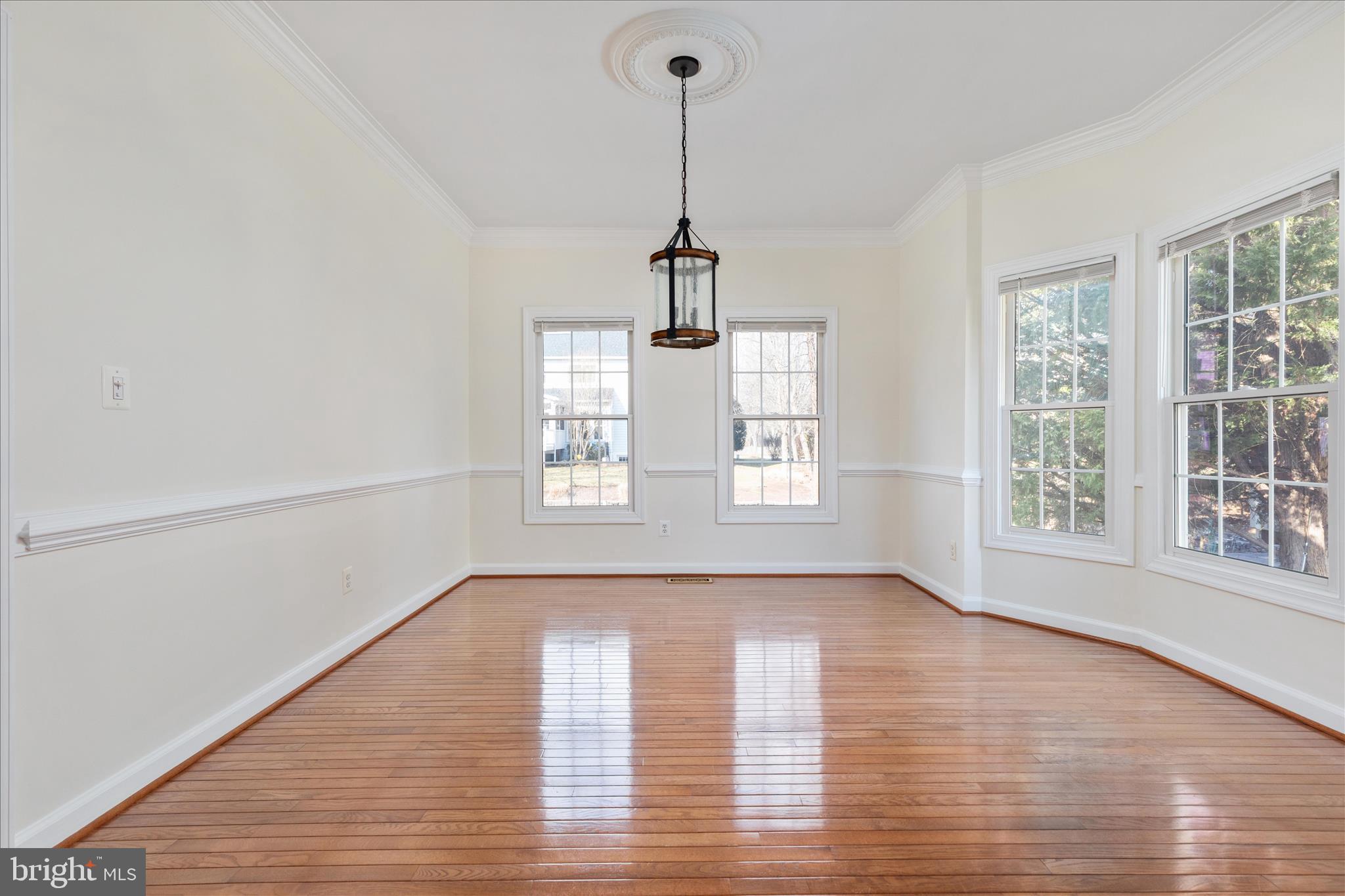 43331 Ritter Lane South Riding, VA 20152 - Photo 9 of 55 a view of empty room with wooden floor and fan