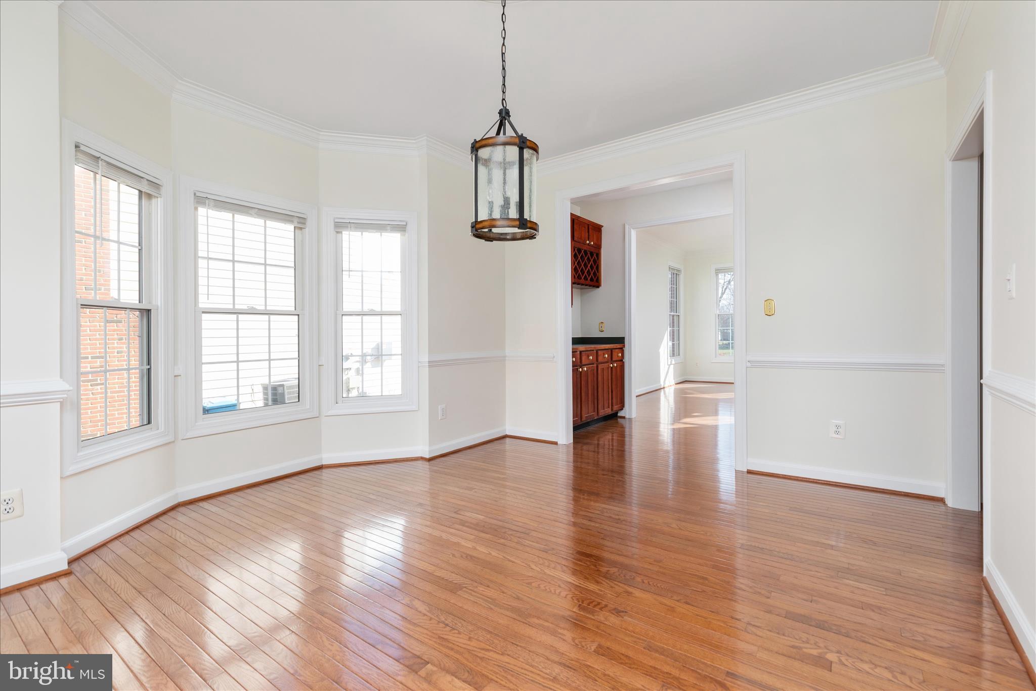 43331 Ritter Lane South Riding, VA 20152 - Photo 10 of 55 a view of an empty room with wooden floor and a window