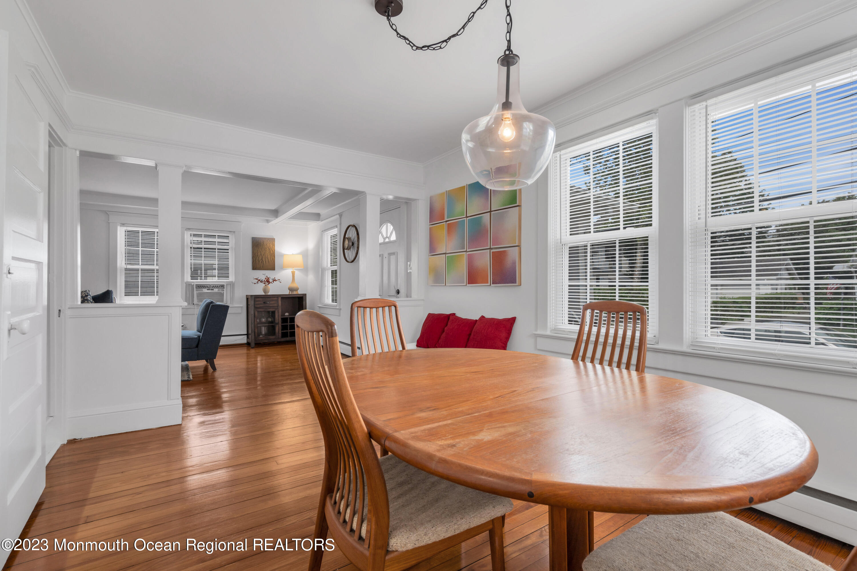 1107 5th Avenue Spring Lake, NJ 07762 - Photo 14 of 38 a view of a dining room with furniture wooden floor and chandelier