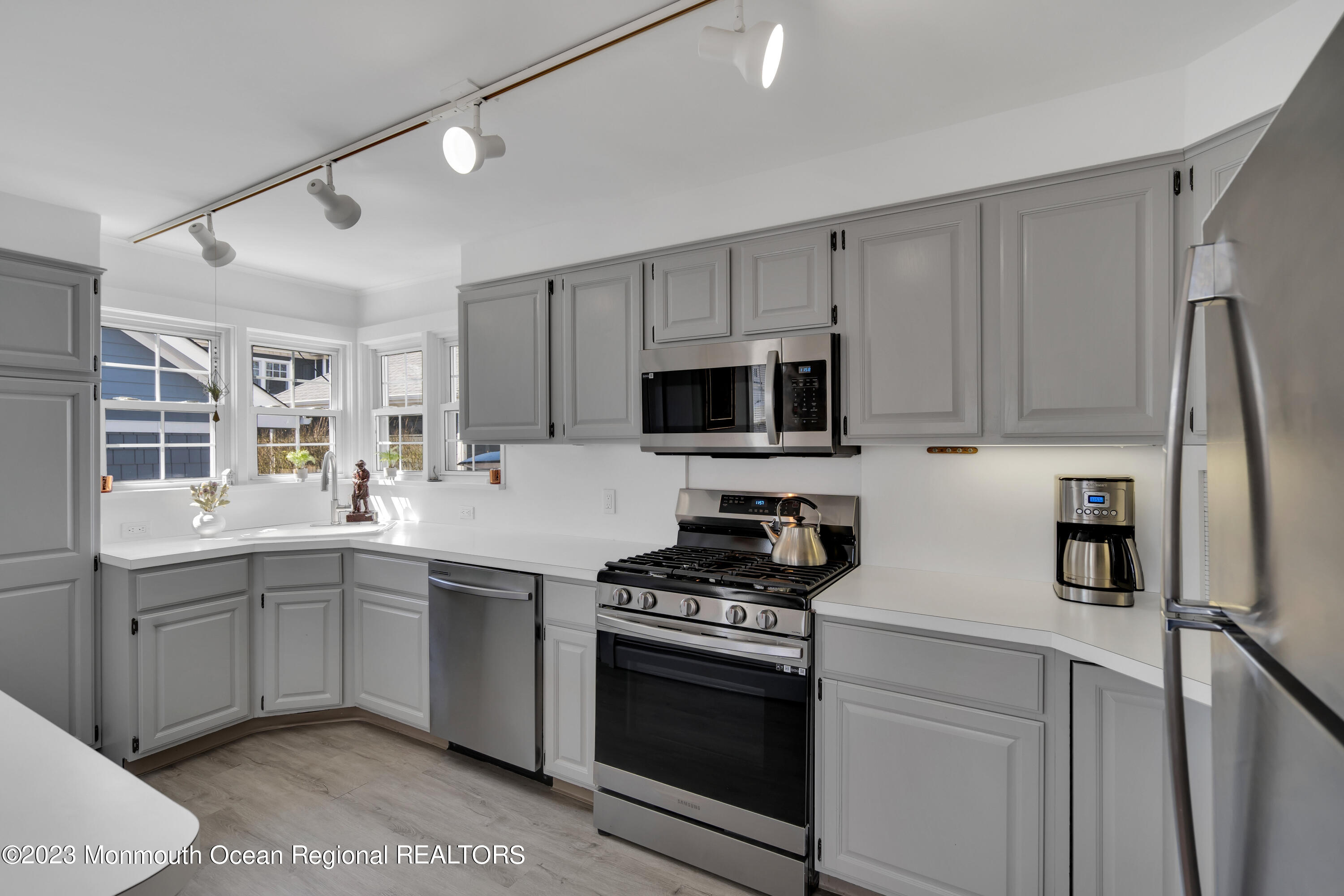1107 5th Avenue Spring Lake, NJ 07762 - Photo 17 of 38 a kitchen with stainless steel appliances a sink stove and refrigerator